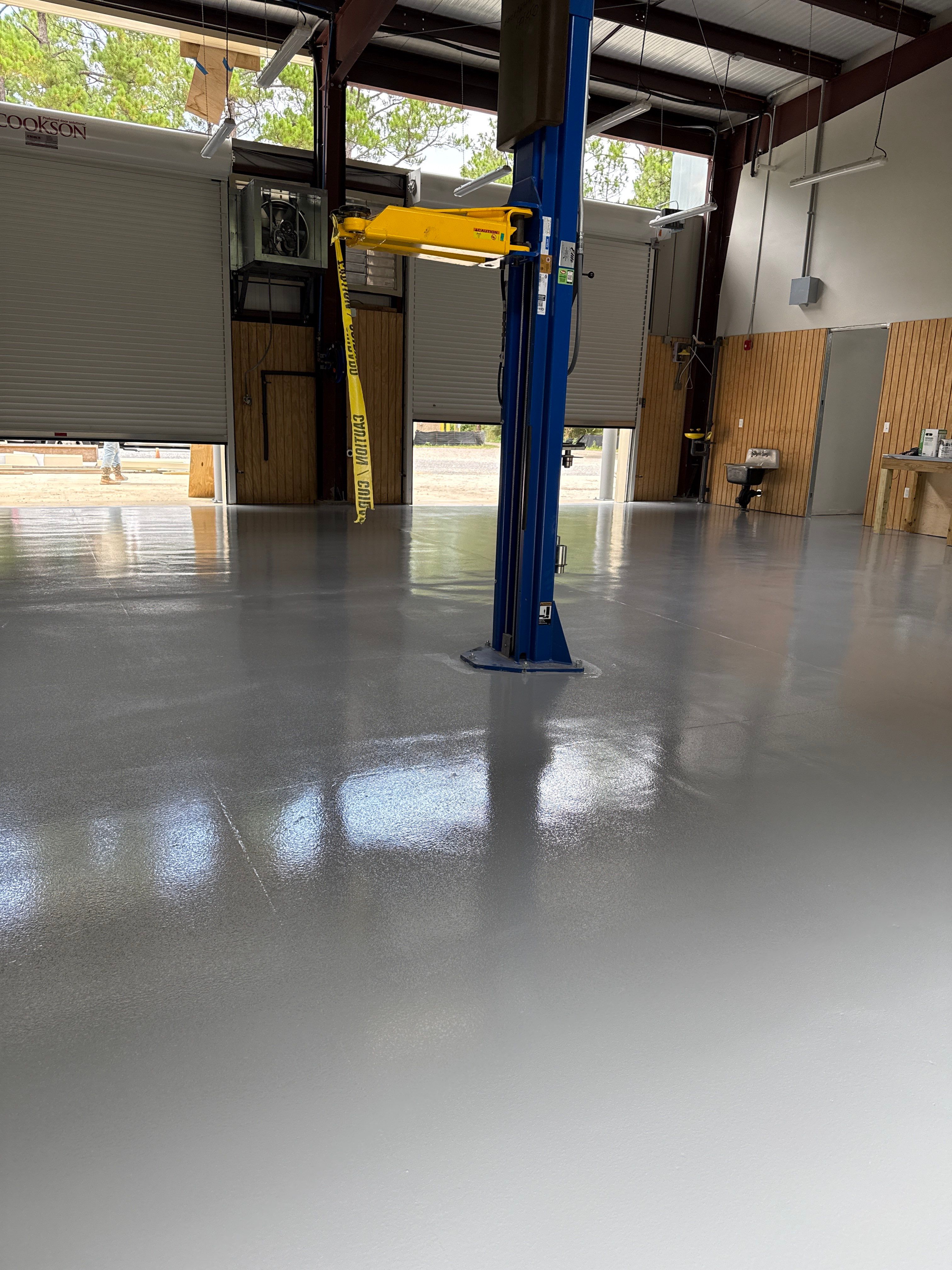 Industrial Epoxy Flooring for Sandhill Crane Workshop in Gautier by Cornerstone Hard Surface Restoration 