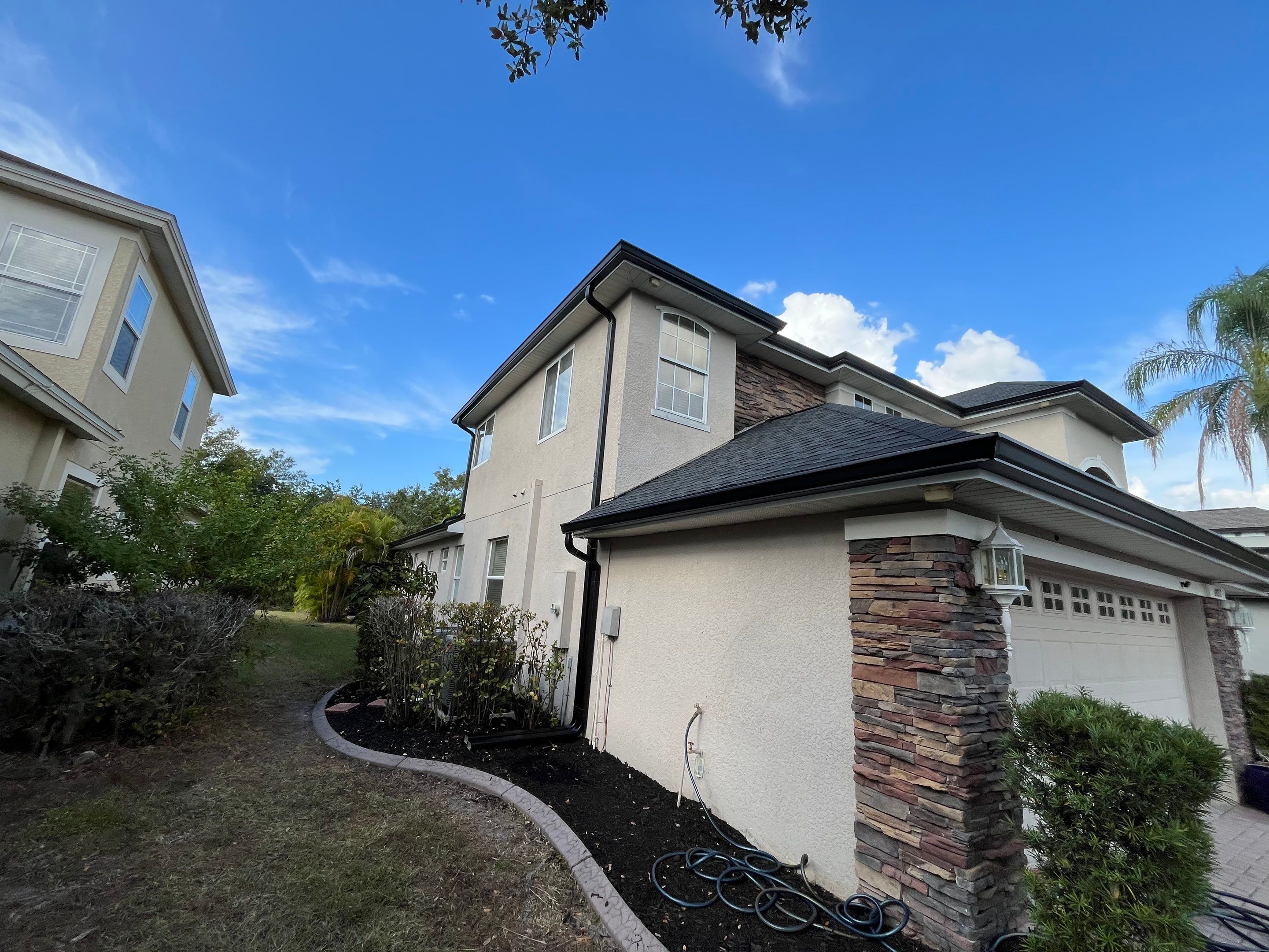 Black 6-inch Seamless Gutters for Modern Ellenton Homes FL by Gutter Professors