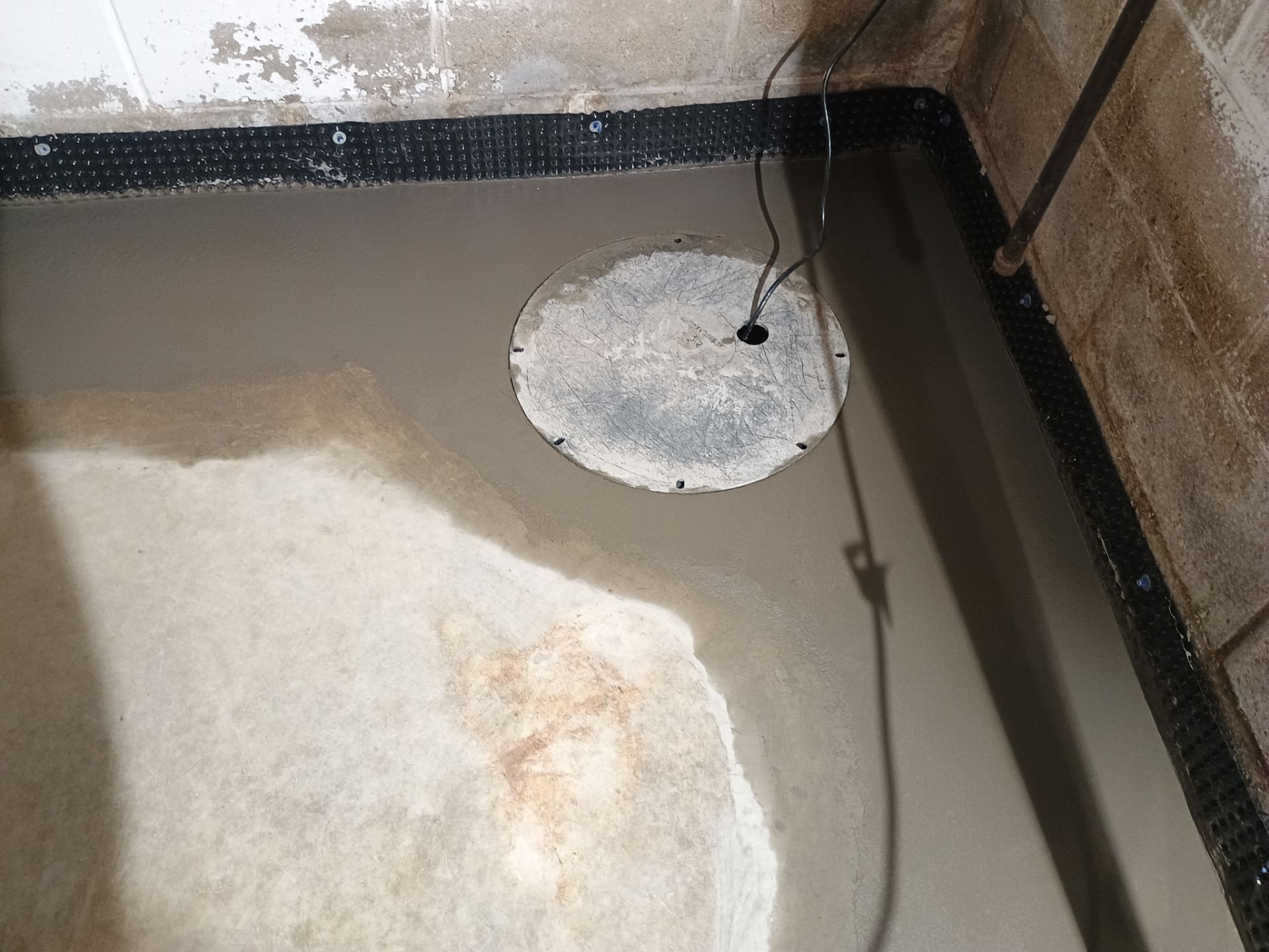 Interior Drain Tile Installation near Columbia Heights, MN by Waterproofing Northeast