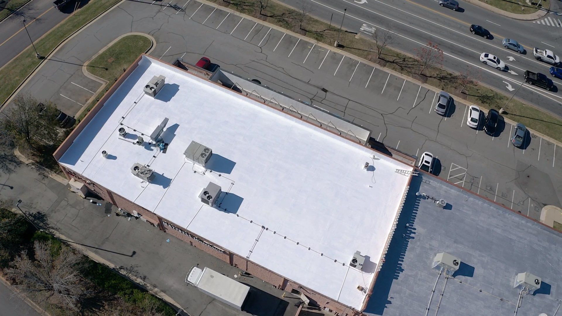 Commercial Coating using Poly Urerthane and Silicone Coating by Just In Time Roofing and Restoration