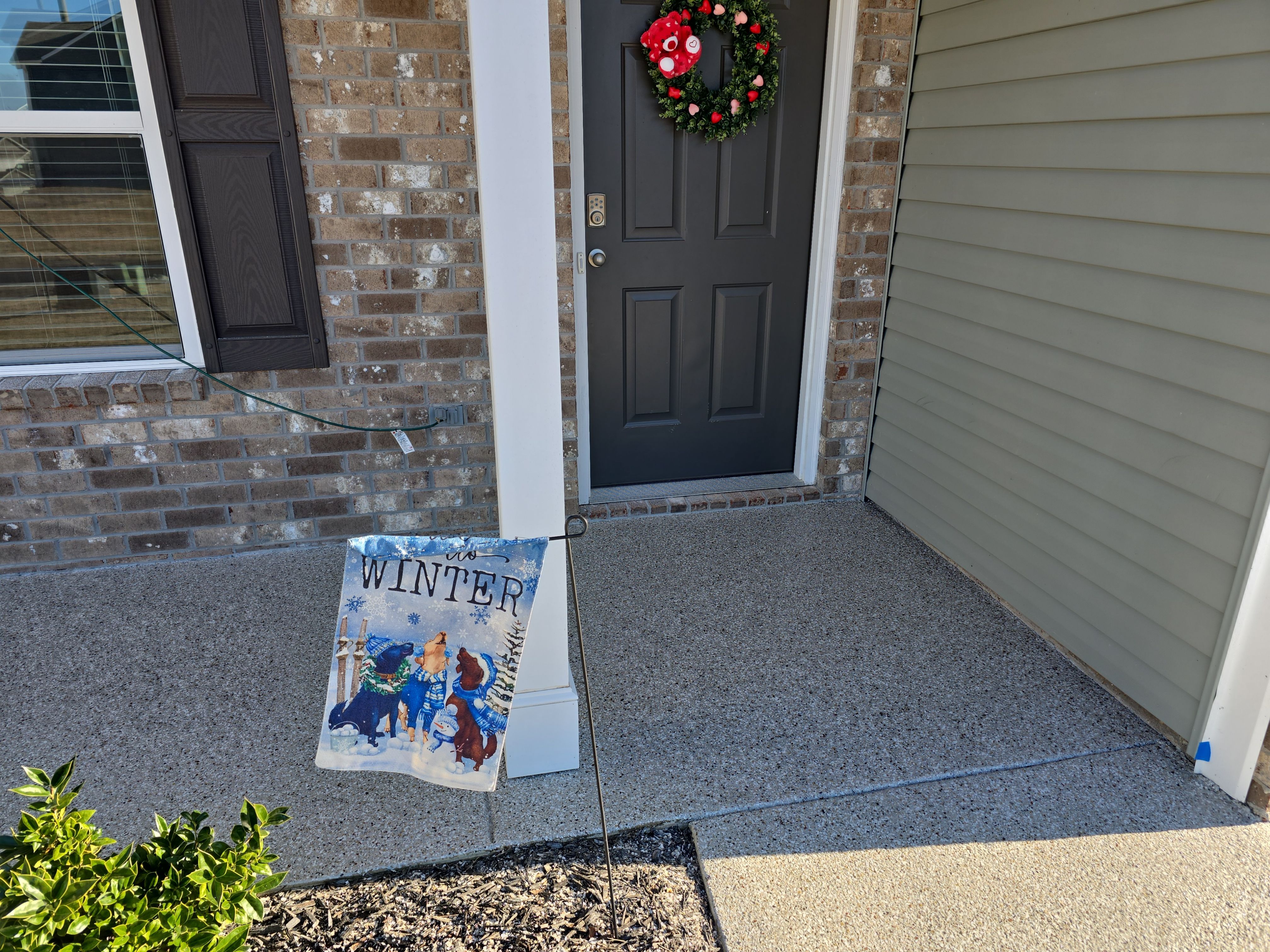 Driveway, Garage, & Front Porch using Creekbed by Elite Floor Solutions