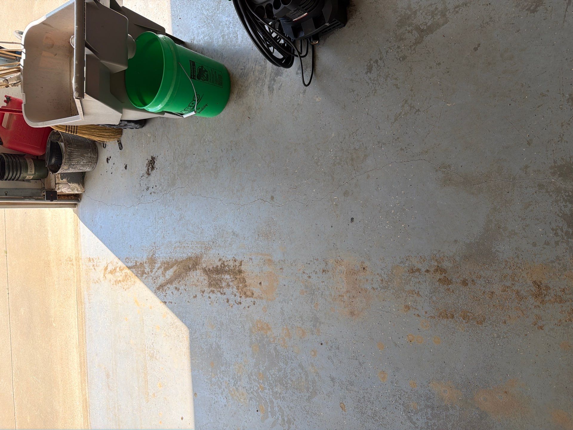 Feather Grey Garage Floor Coating Installation in Valley Springs by Select Painting, Coatings & Garage Cabinets