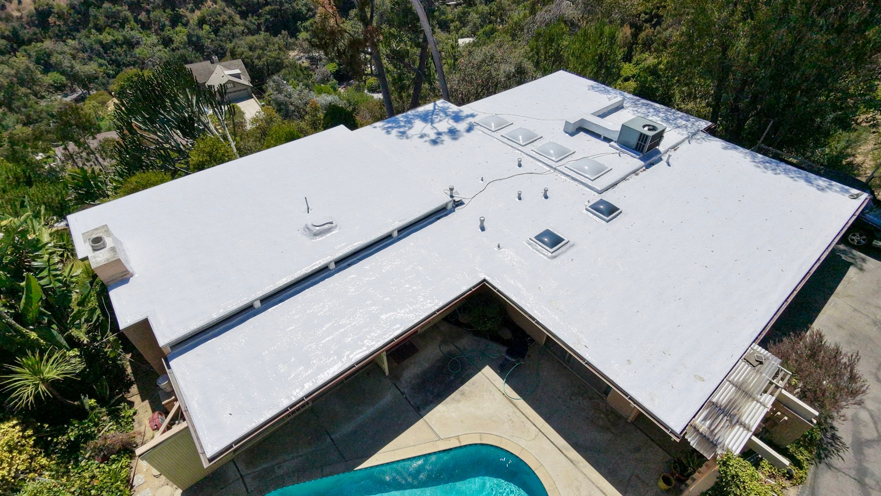 Residential Flat Roof Restoration with Silicone Coating in Brentwood by Hull Brothers Roofing