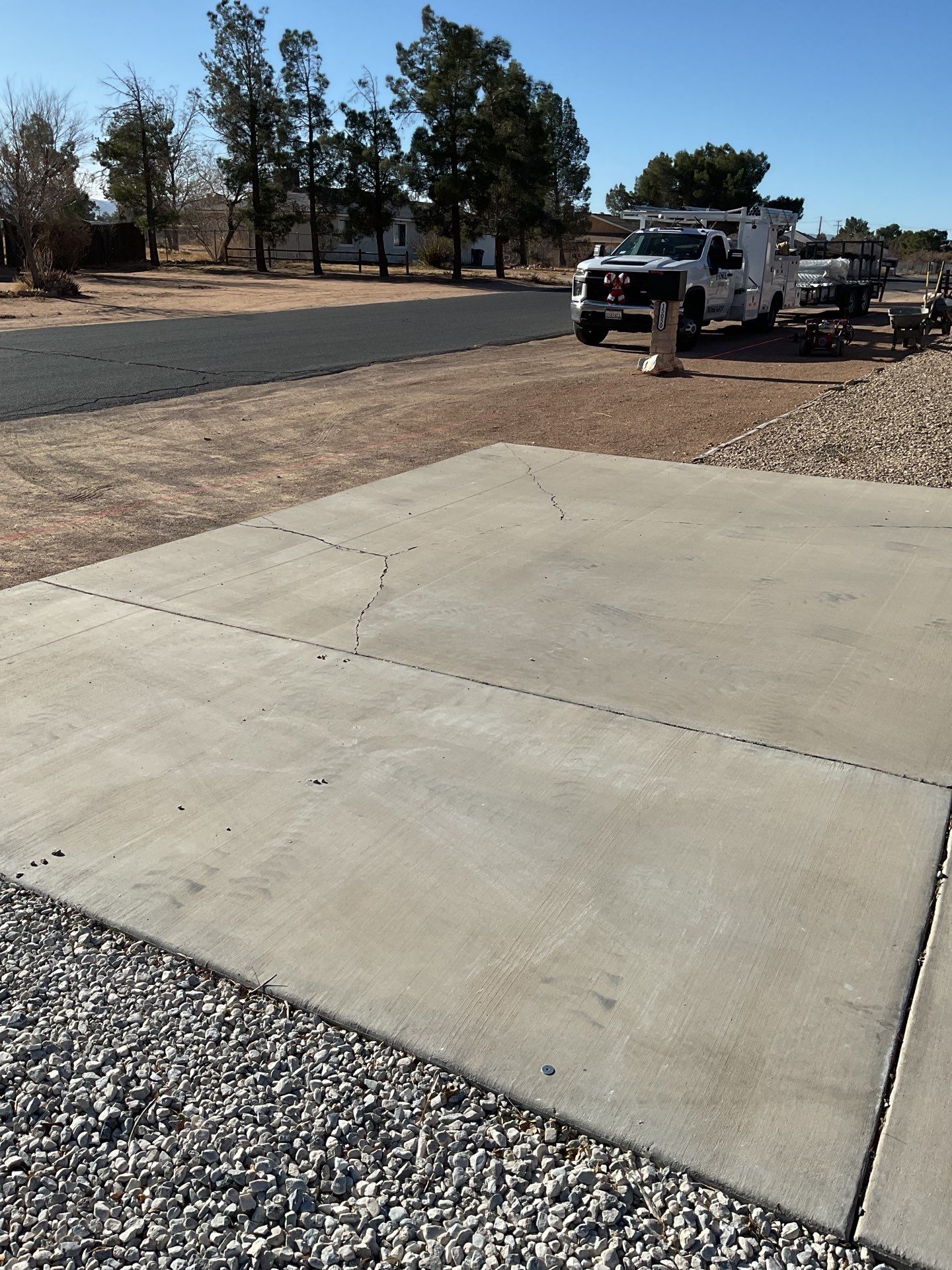 Sleek chain link fence installation with a solar motorized gate by Fence Guys Inc.