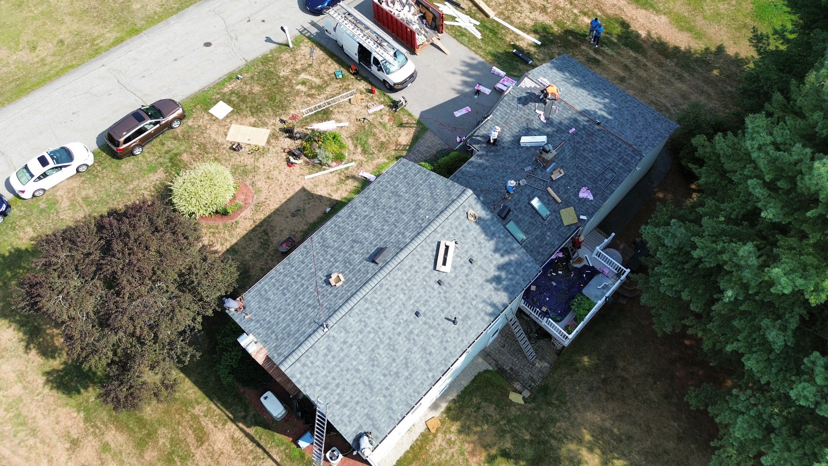 Complete Roof Replacement with Chimney Flashing, Gutter Guard System, and Vinyl Siding Repairs by Mighty Dog Roofing of Greater Middlesex County