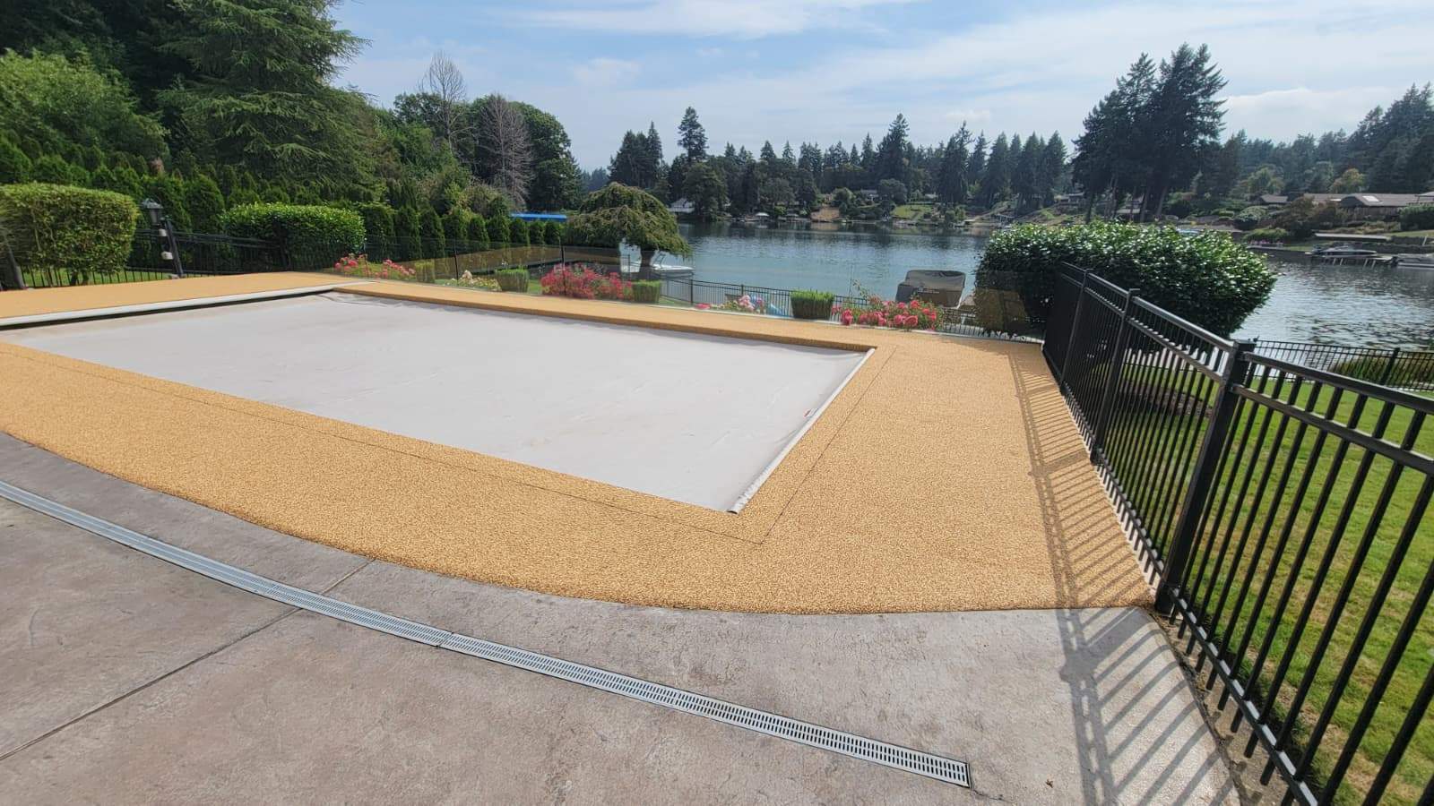 Pool Deck with Rubber Stone Finish by Concrete Coating Experts Inc.