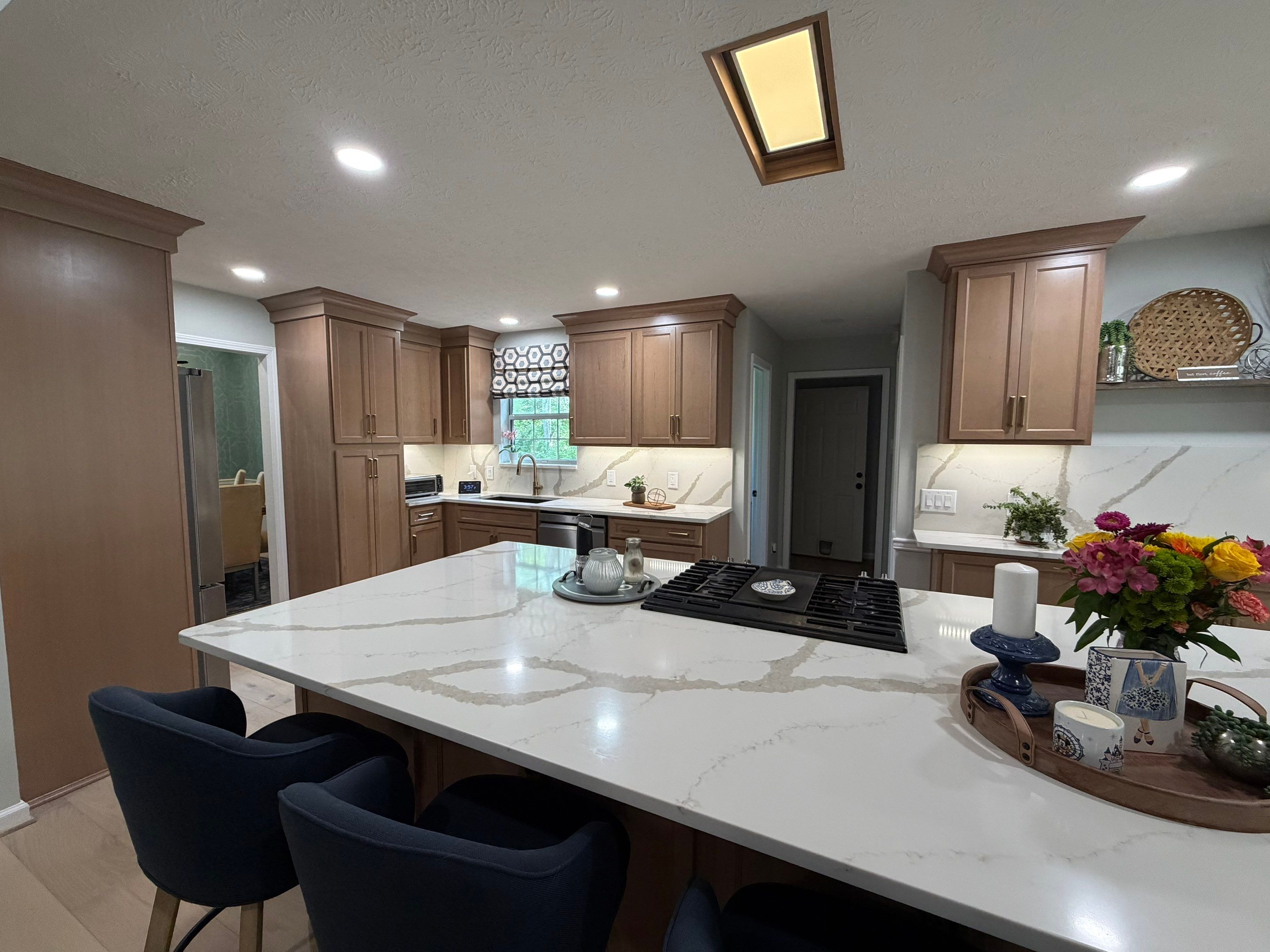 Modern Kitchen Remodel Featuring Quartz Backsplash, under cabinet lighintg, and a coffee bar in Mt. Juliet Tennessee by DeRo Renovations,LLC
