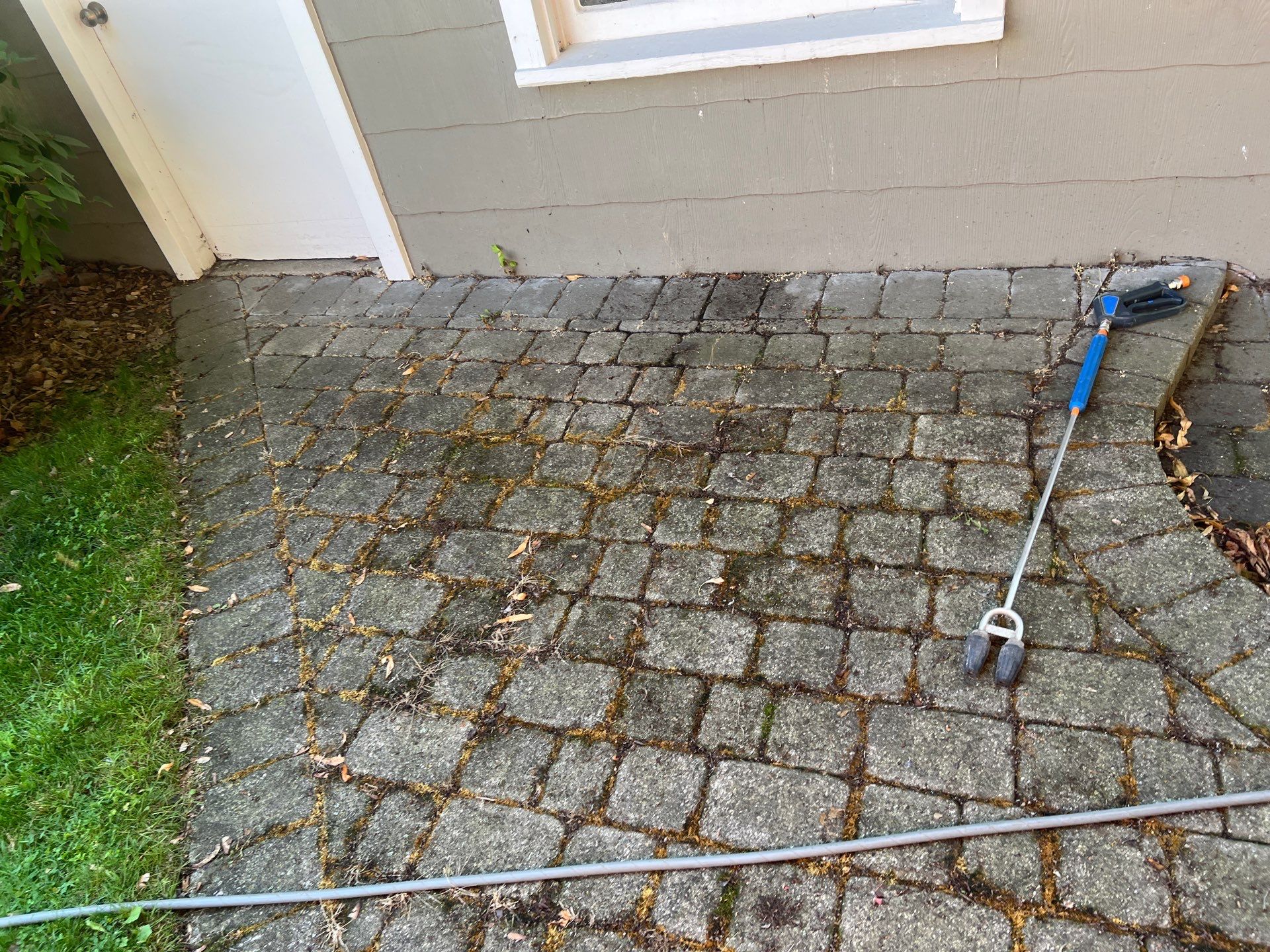 Brick paver cleaning and sealing by Northern Power Washing LLC.