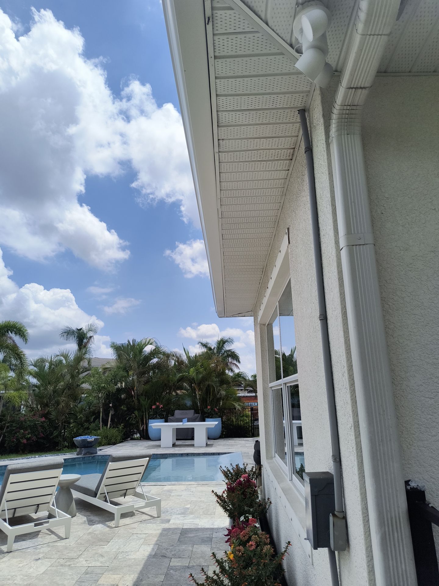 White Seamless Gutters with Downspouts in Bradenton FL by Gutter Professors