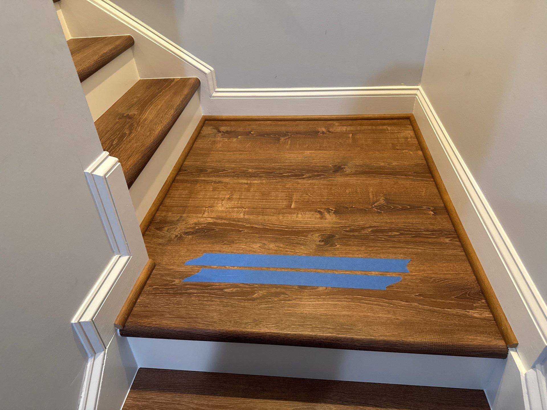 Stairway Installation using t vinyl stair tread and reversibleriser by La Bendicion Contruction Llc