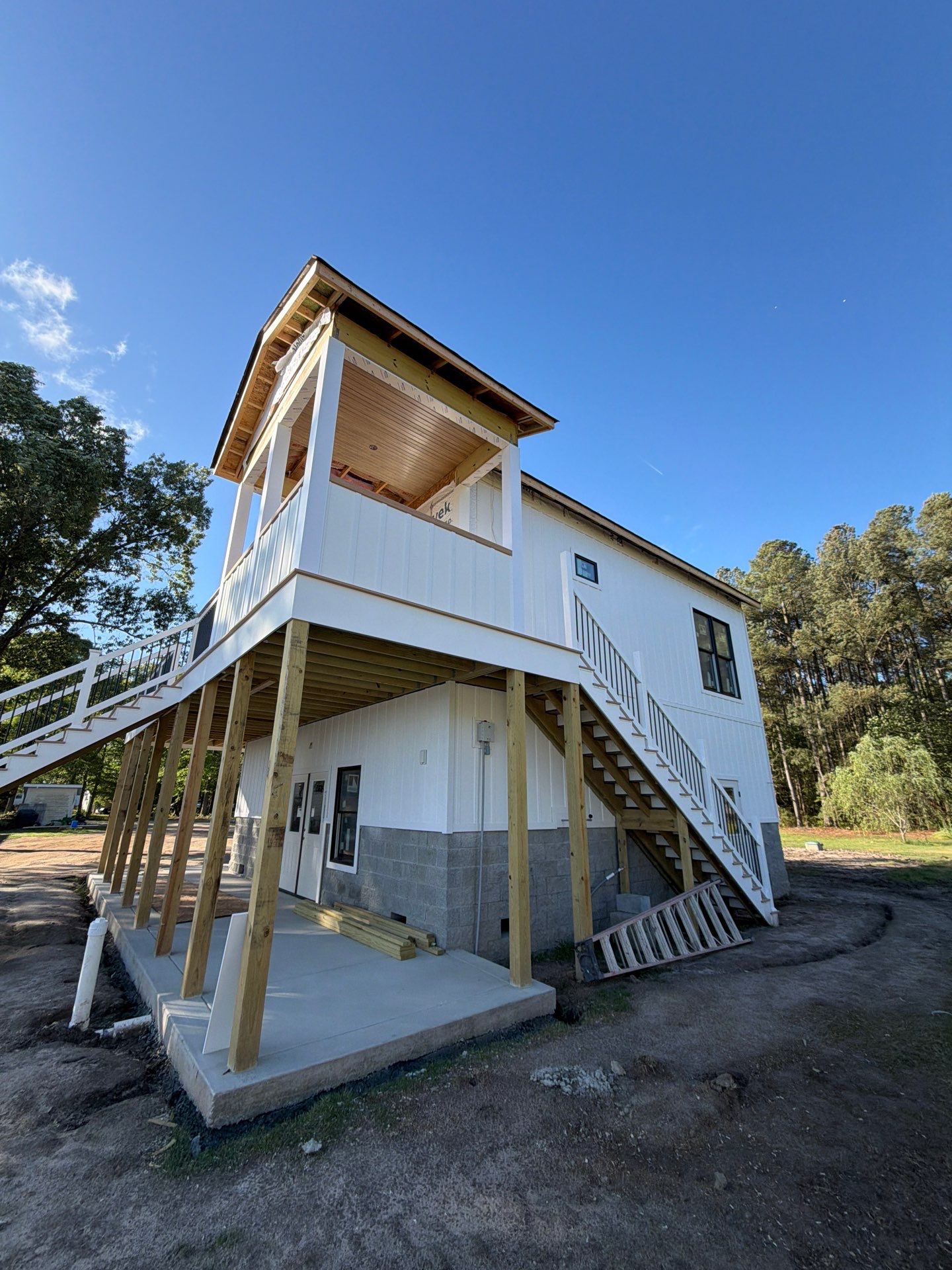 Two-Story Custom Home With Board and Batten Siding by Cade Construction