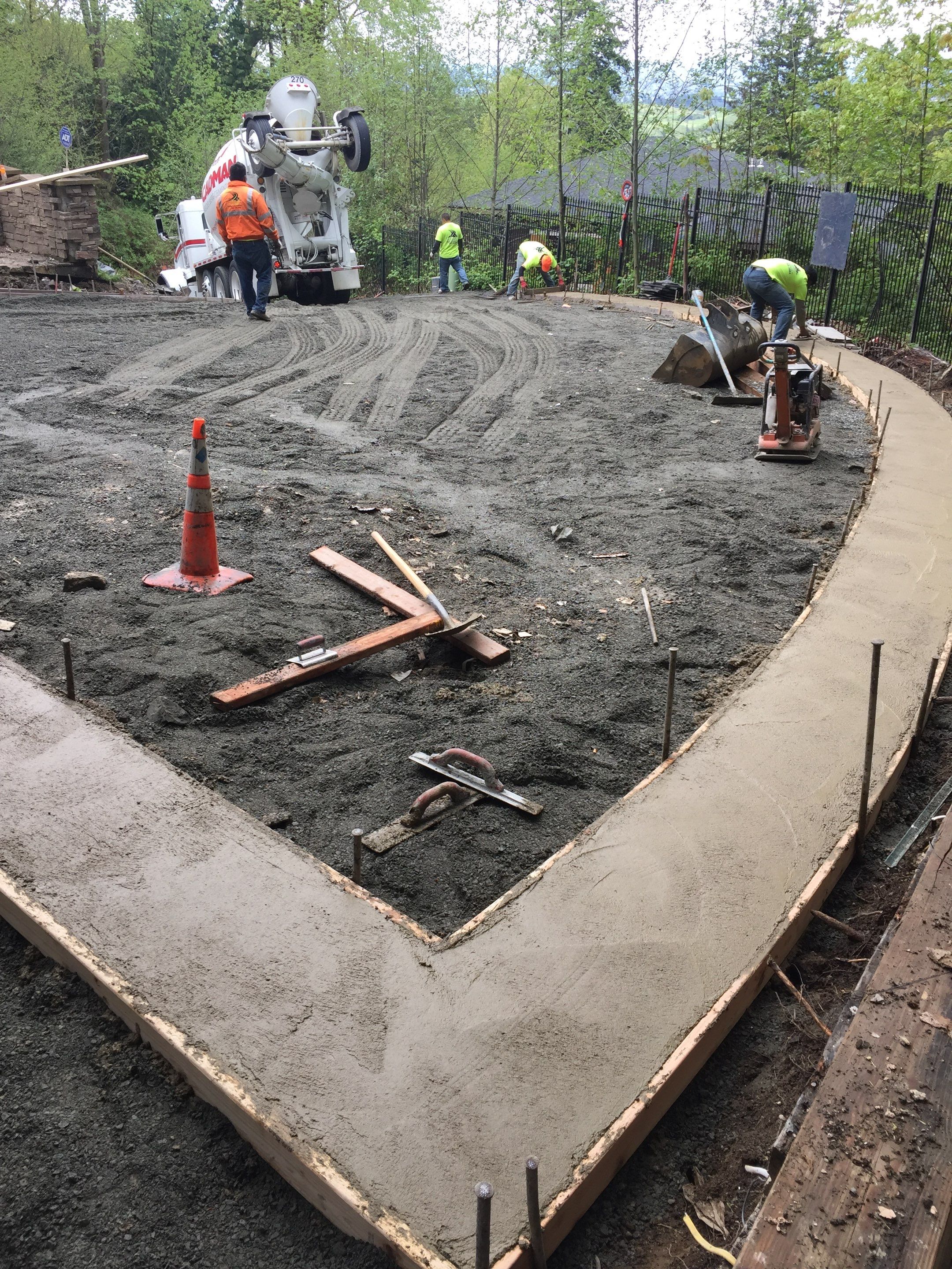 Asphalt Driveway and Stamped Concrete Patio Finish  by Jireh Asphalt & Concrete Inc 