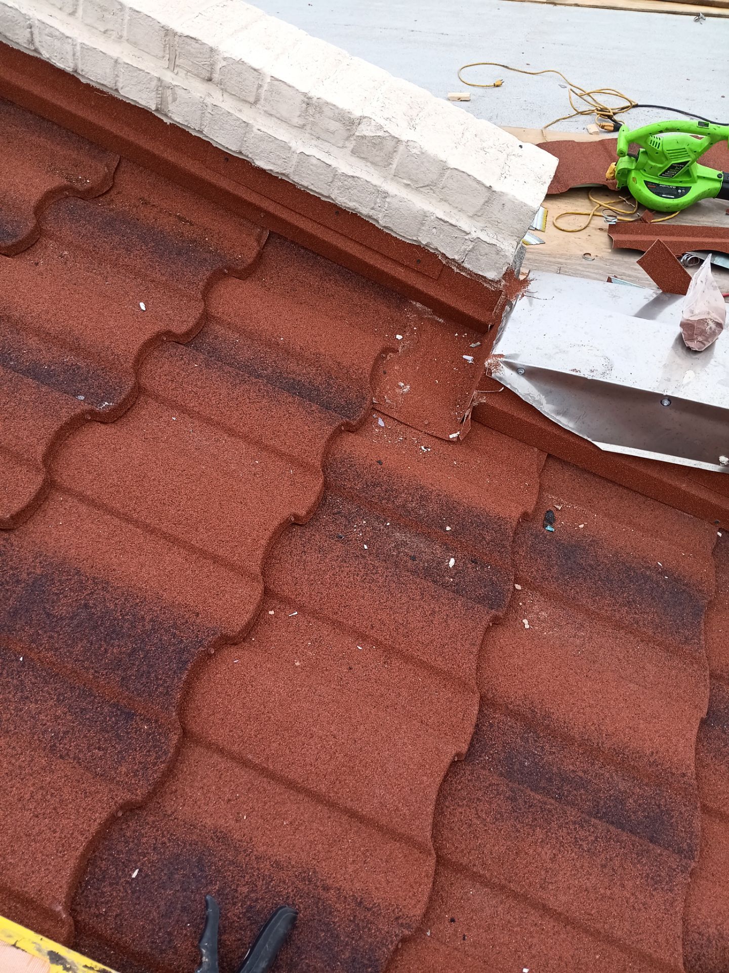 Off with the Tile and on with the TILCOR stone coated metal.  by Bayfront Roofing and Construction