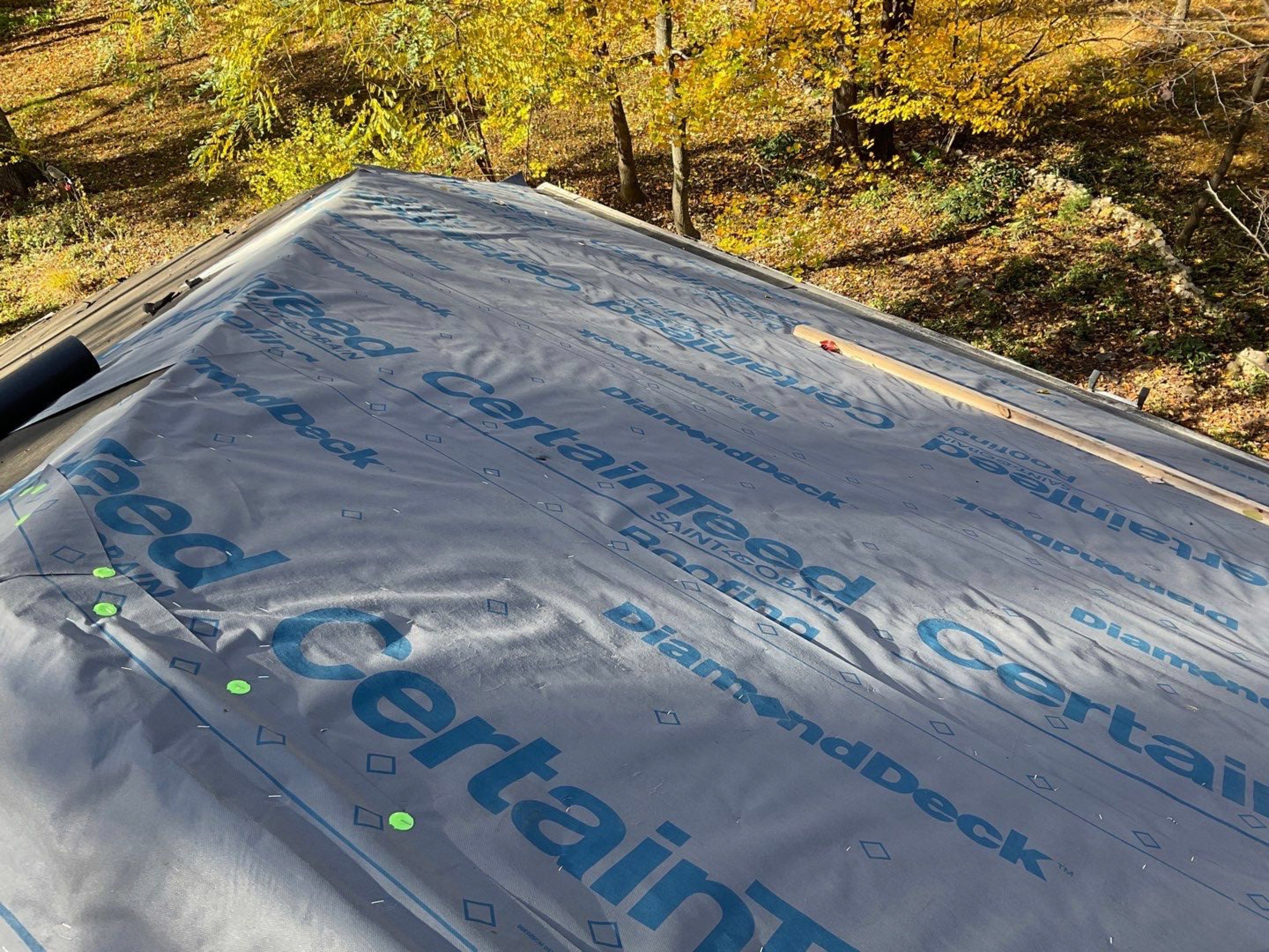 Install new shingles and new skylights  by Alpha Design Services
