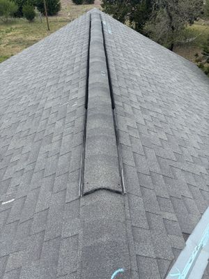 Architectural asphalt shingle roof with ridge cap installed