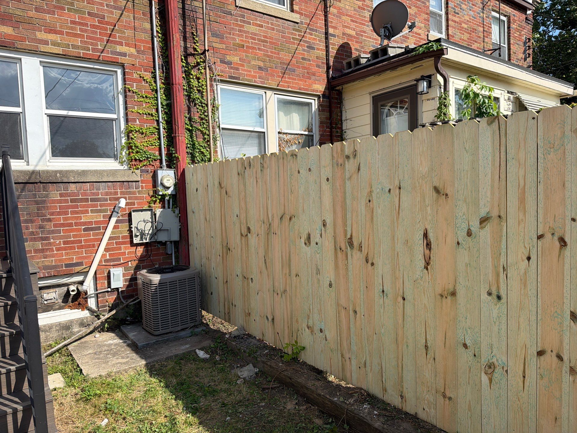 New Treated Wood Privacy Fence and Metal-Framed Gates by Perfect Picket Fence and Stain