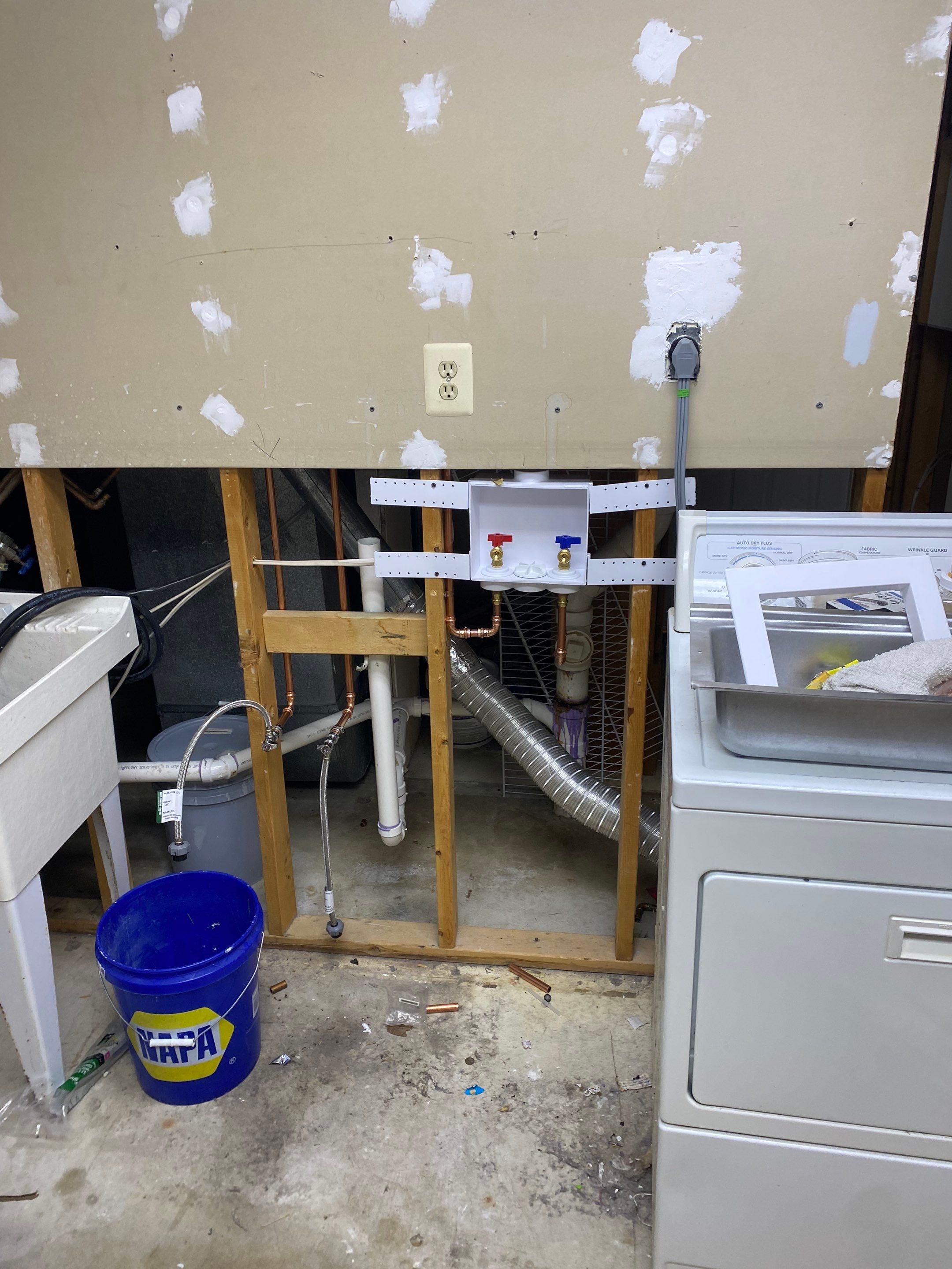 Laundry Room Redmodel using Lifeproof Luxury Vinyl Plank Flooring by The Smet Companies, LLC