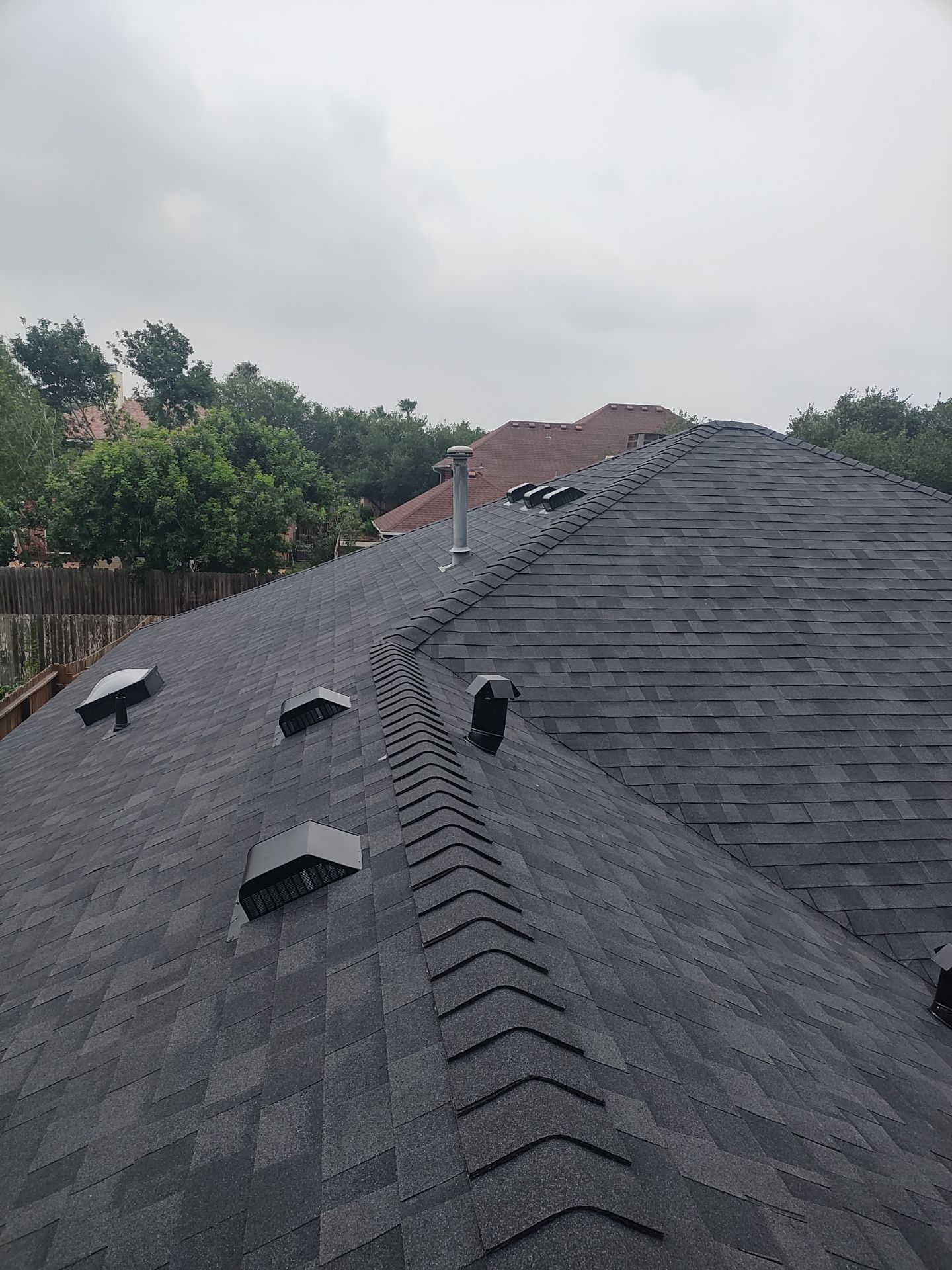 Nothing looks nicer than a little black roof by Bayfront Roofing and Construction