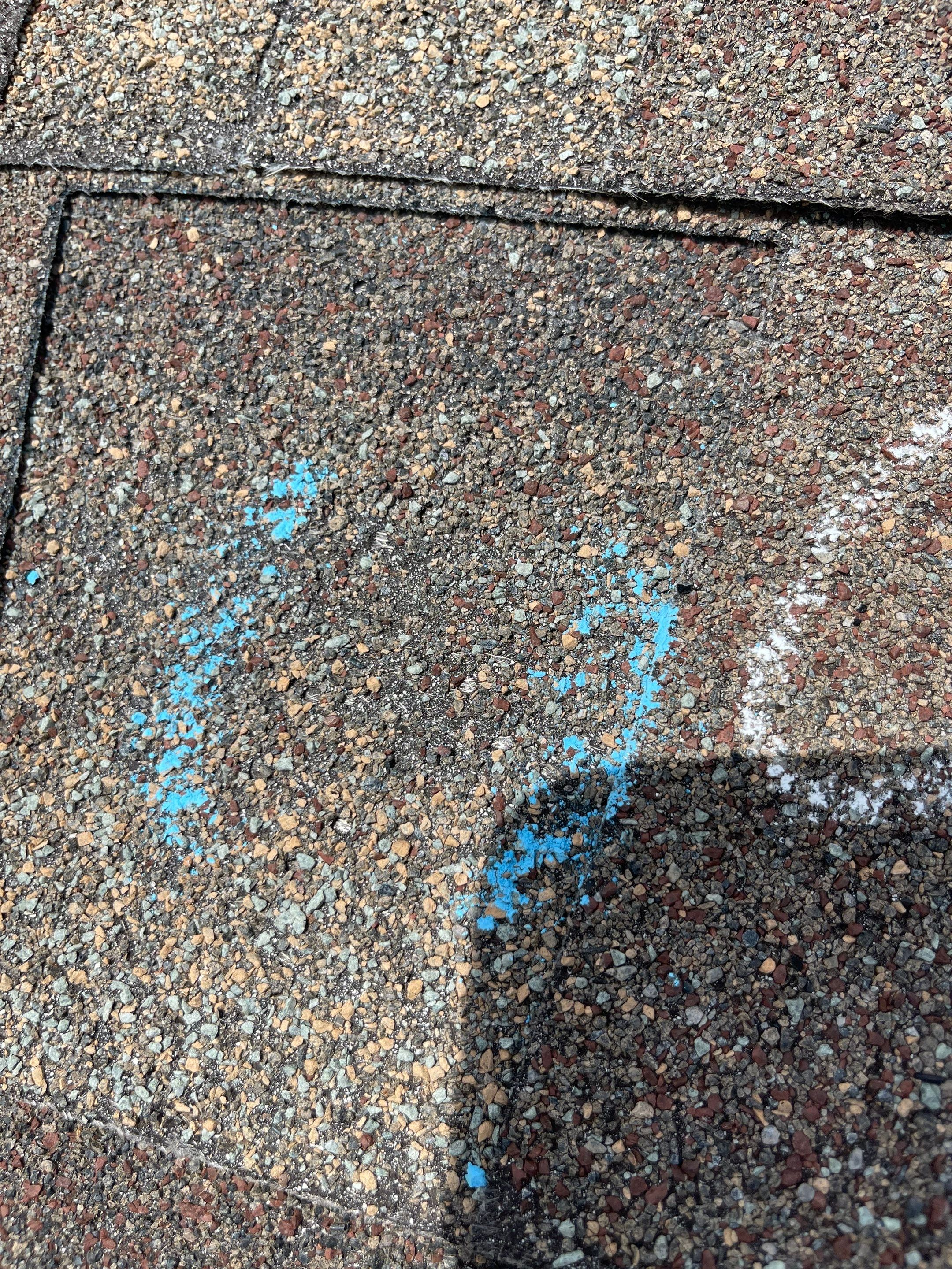 Hail Damage on a Roofing System by Icon Roofing And Construction 