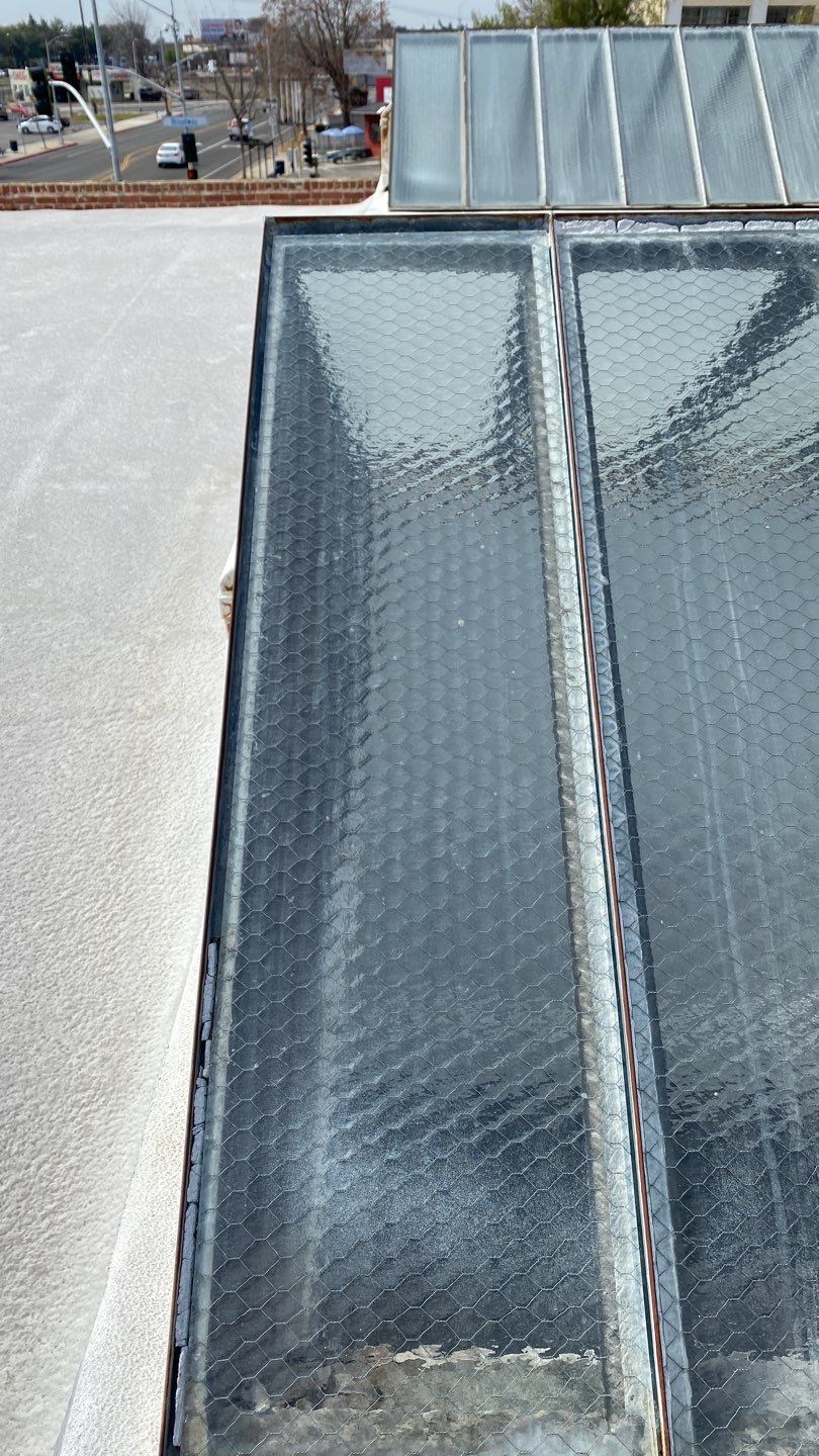 Polyurethane foam roof refurbish and recoating by Straight Edge Roofing Inc