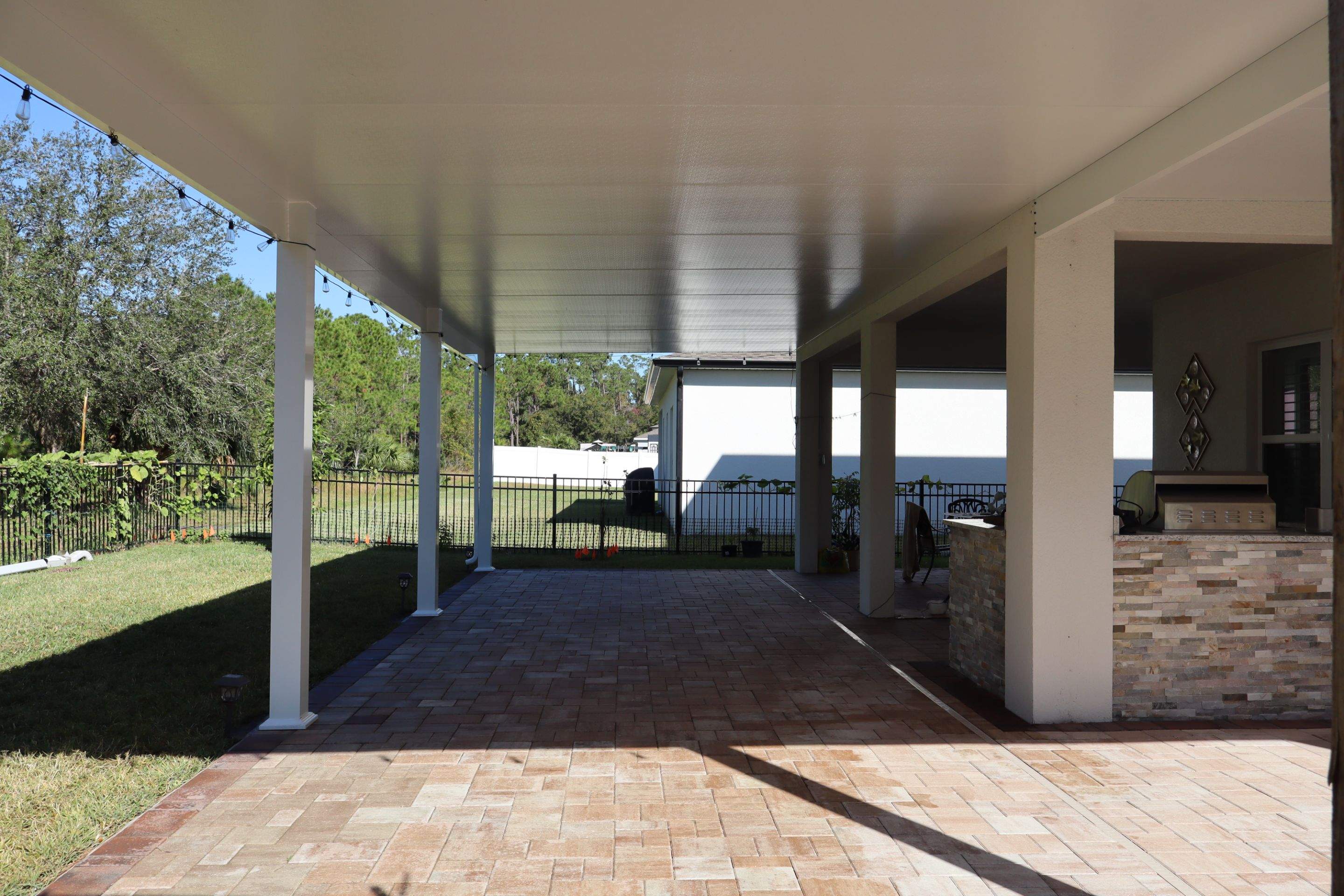 Patio cover with kitchen by Orlando pergolas 