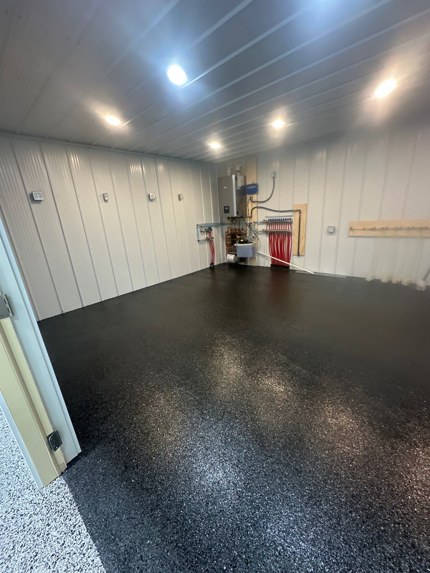 Barndominium Flake Coating using Polyaspartic by Revival Concrete Coatings