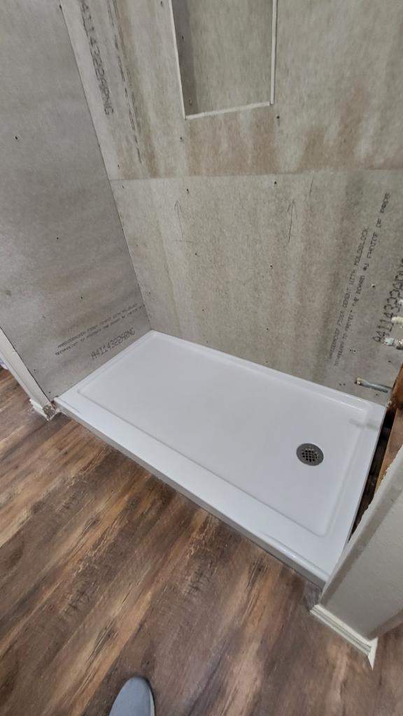 Bathroom Remodel using Tile  by SLM General Contractors & Roofing