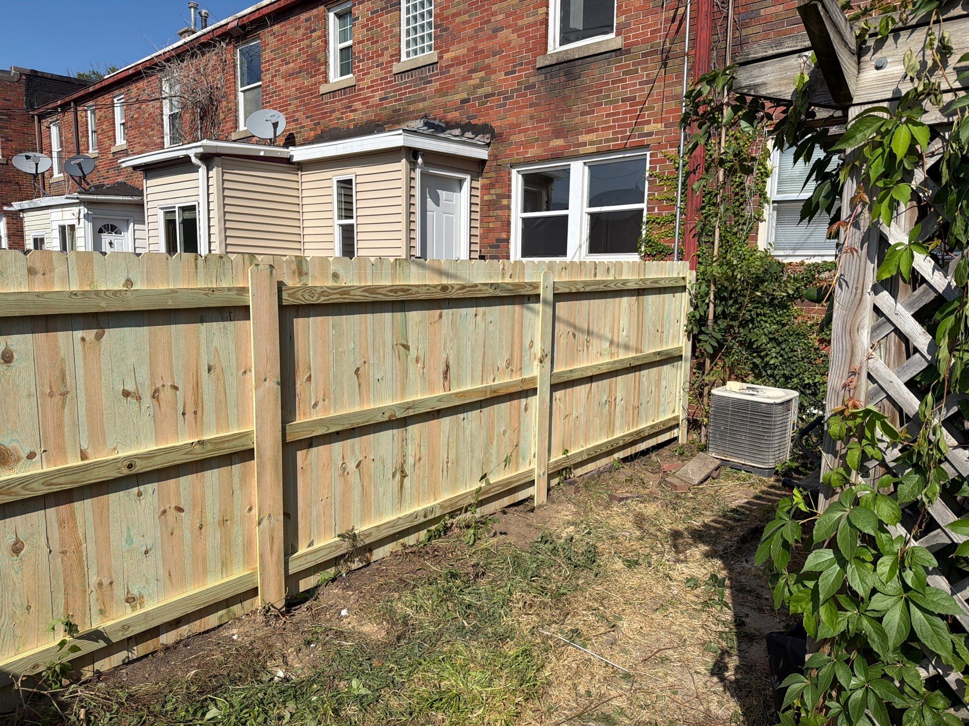 New Treated Wood Privacy Fence and Metal-Framed Gates by Perfect Picket Fence and Stain