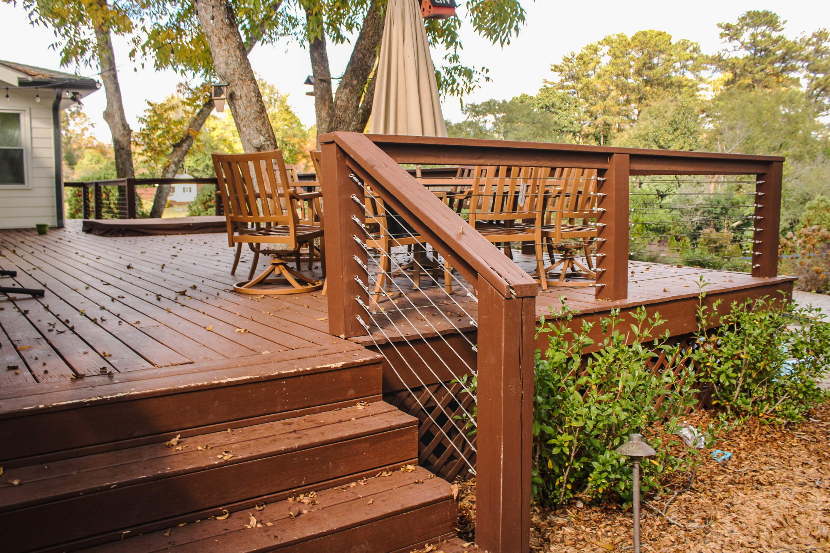 Deck Resurface with Glass Paneling and Deckorators Voyage Series Products by Nelson Exteriors 