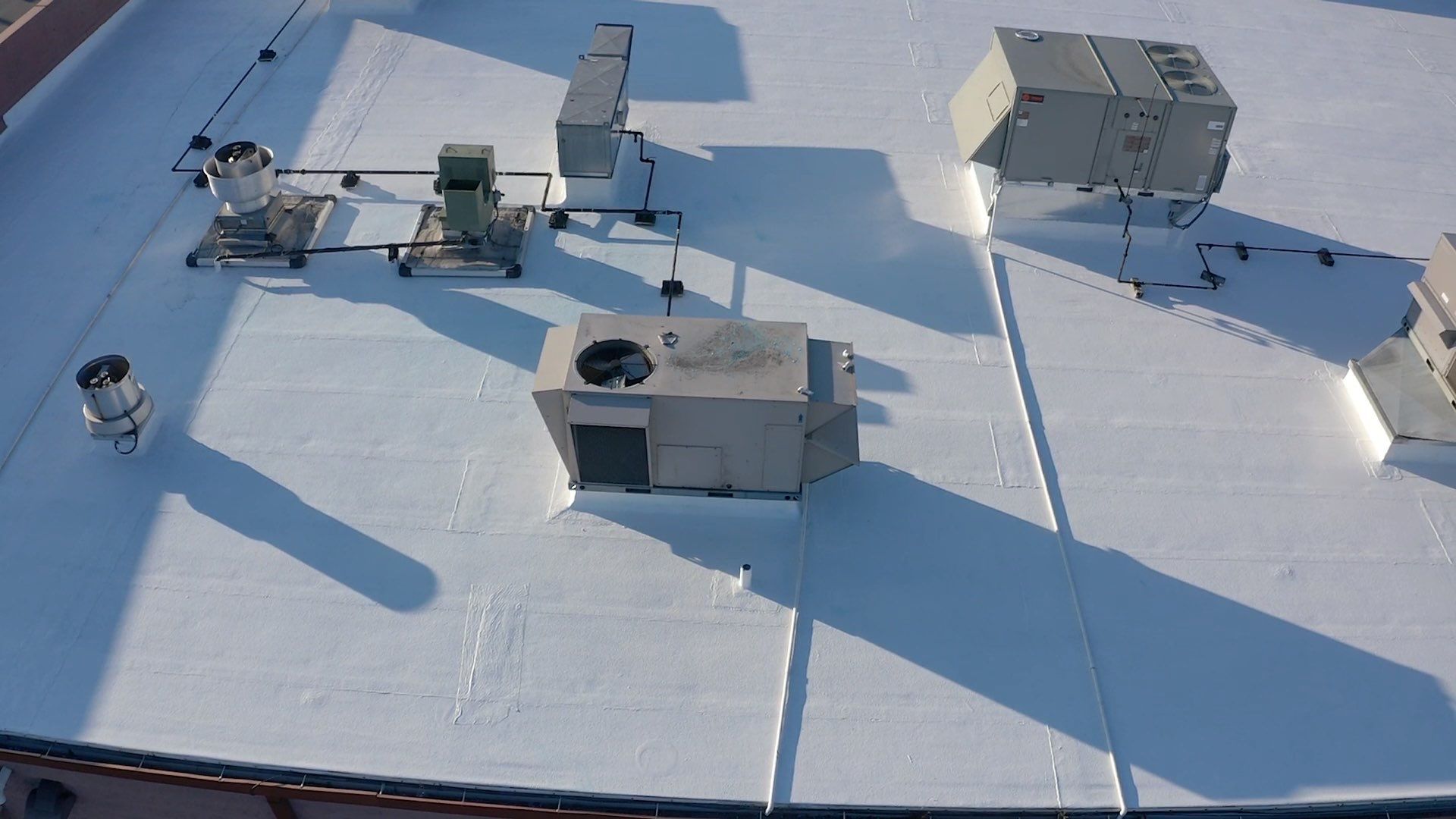 Commercial Coating using Poly Urerthane and Silicone Coating by Just In Time Roofing and Restoration