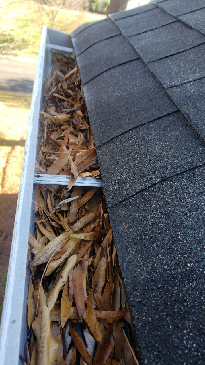 Sara Gutter cleanout using water by G&H Home Tech Pros LLC