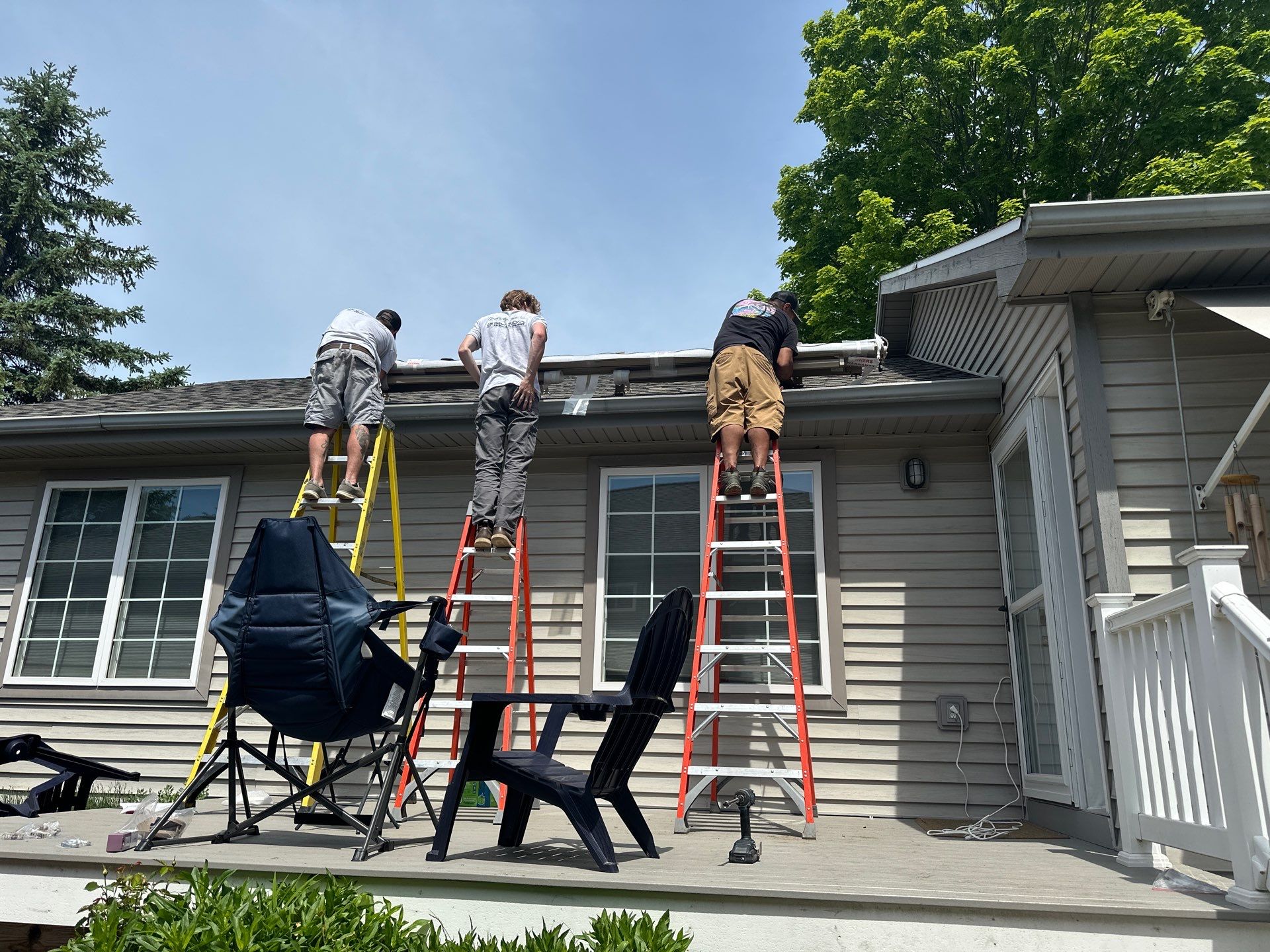 Retractable Sunesta Awning Installation on Traverse City Residential Deck by Rainbow Seamless Systems