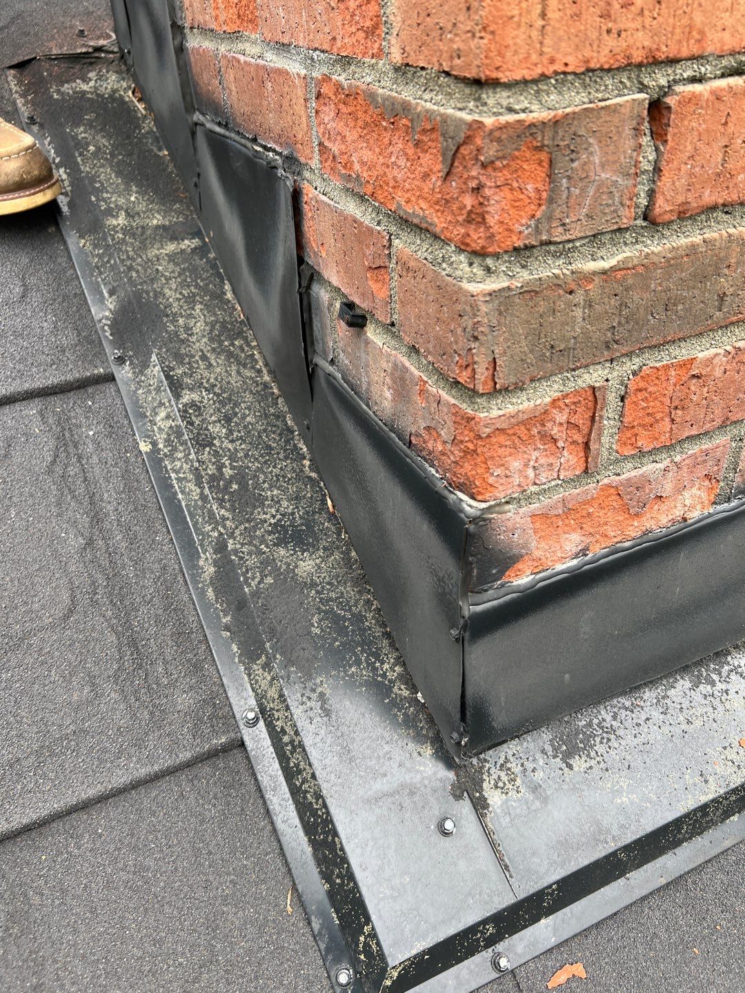 Residential Roofing Repair using Chimney counter flashing by Nitro Roofing and Construction