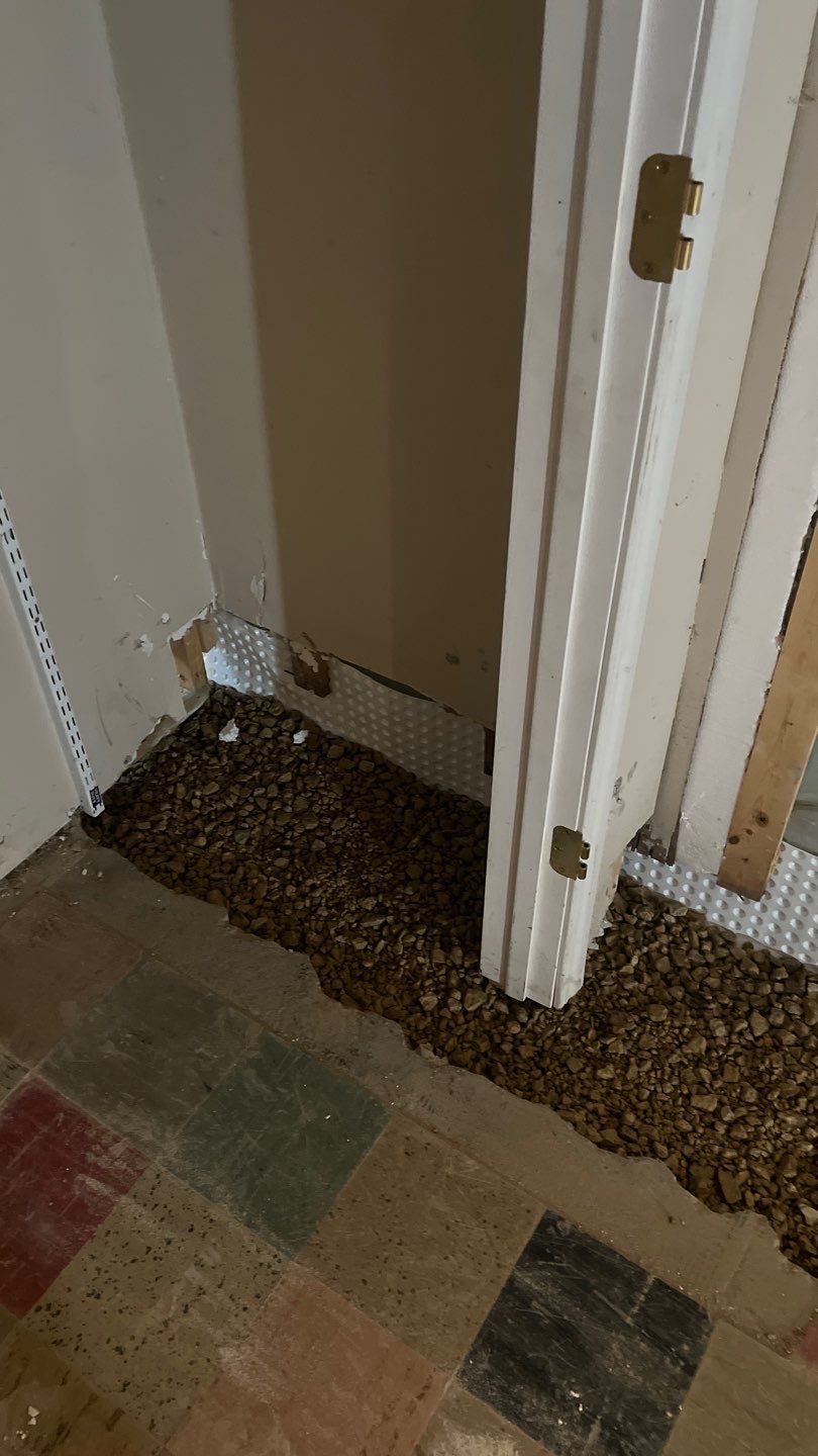 Interior drain tile system installation by ACE Waterproofing & Basement Solutions
