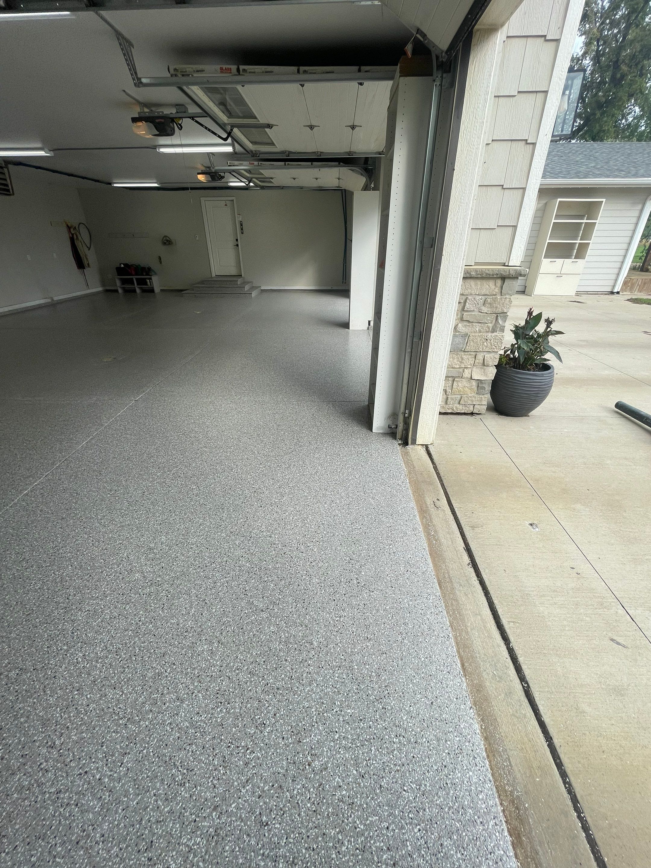 Grey Speckled Polyuera Garage Floor Coating for Hartford Three-Car Garage by Select Painting, Coatings & Garage Cabinets