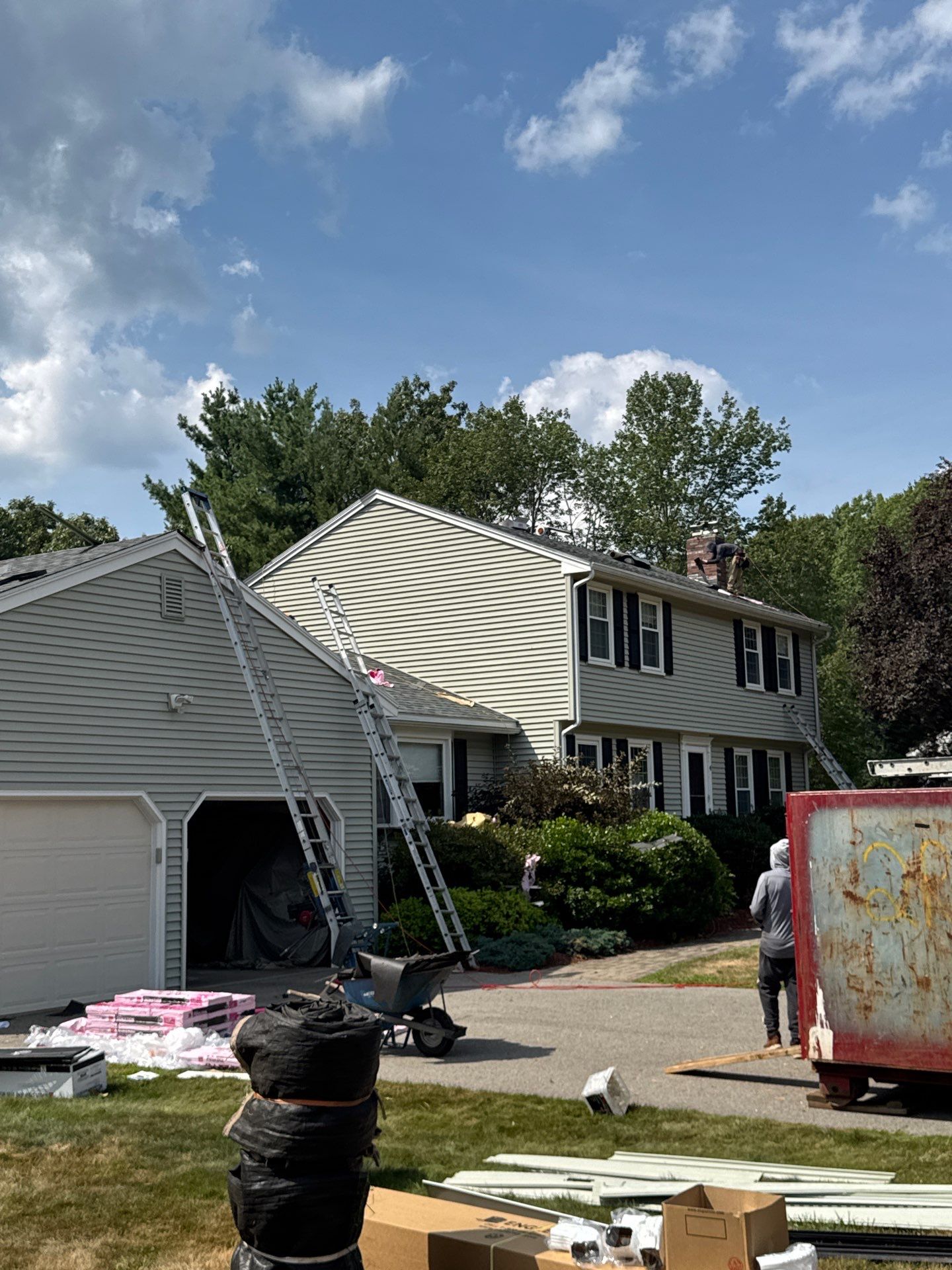 Complete Roof Replacement with Chimney Flashing, Gutter Guard System, and Vinyl Siding Repairs by Mighty Dog Roofing of Greater Middlesex County