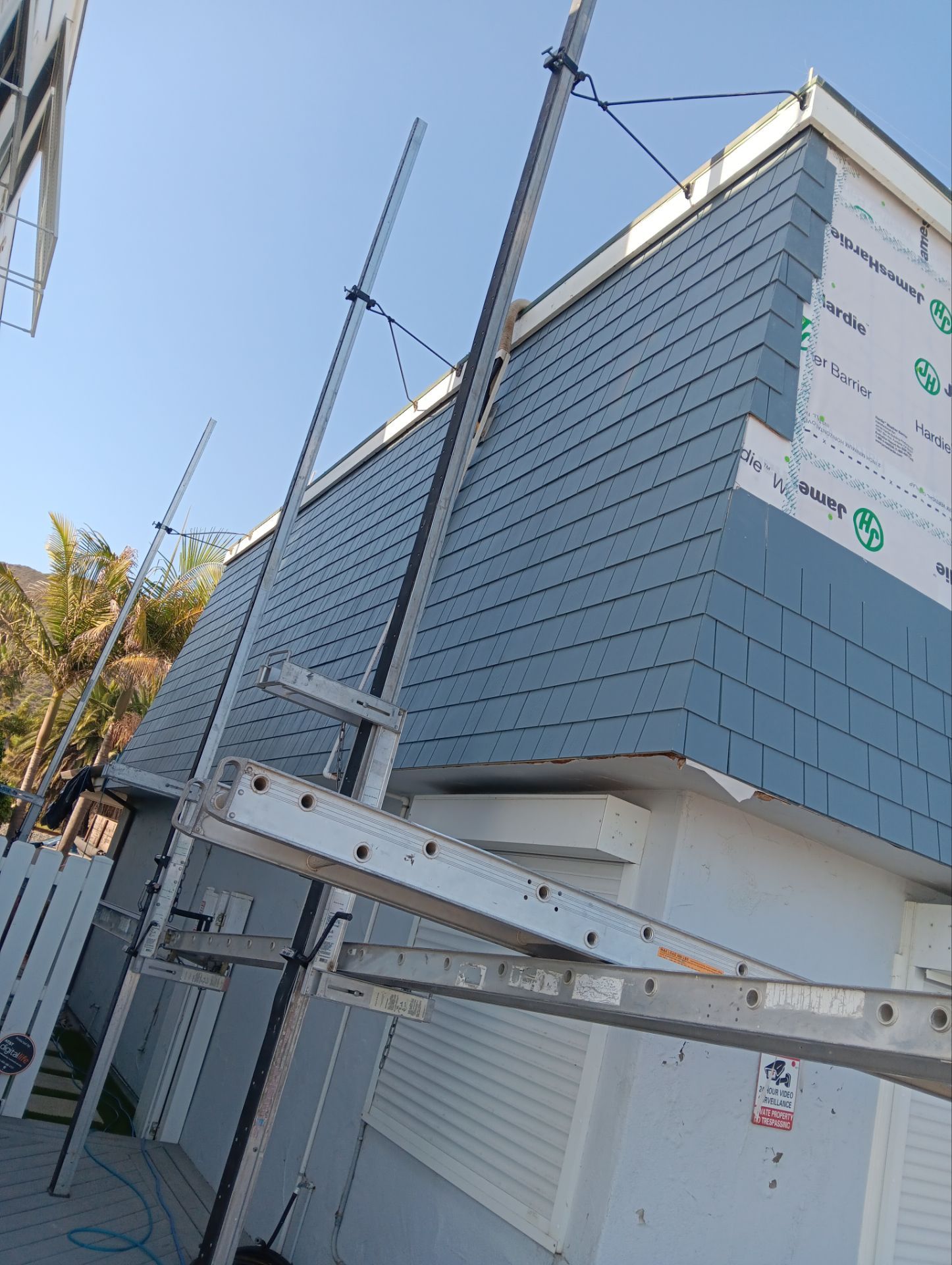 Pre-finish shingles by New Era Siding Inc 