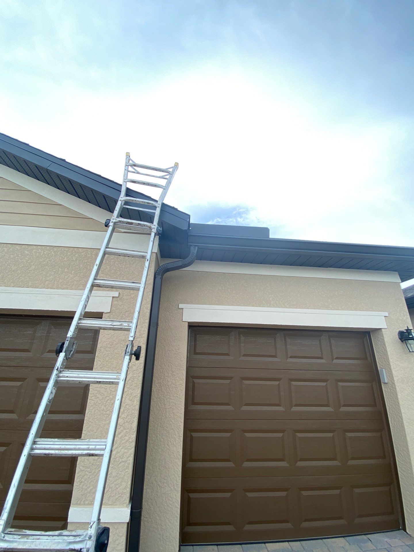 Brown Seamless Gutters for Homes in Fort Myers by Gutter Professors