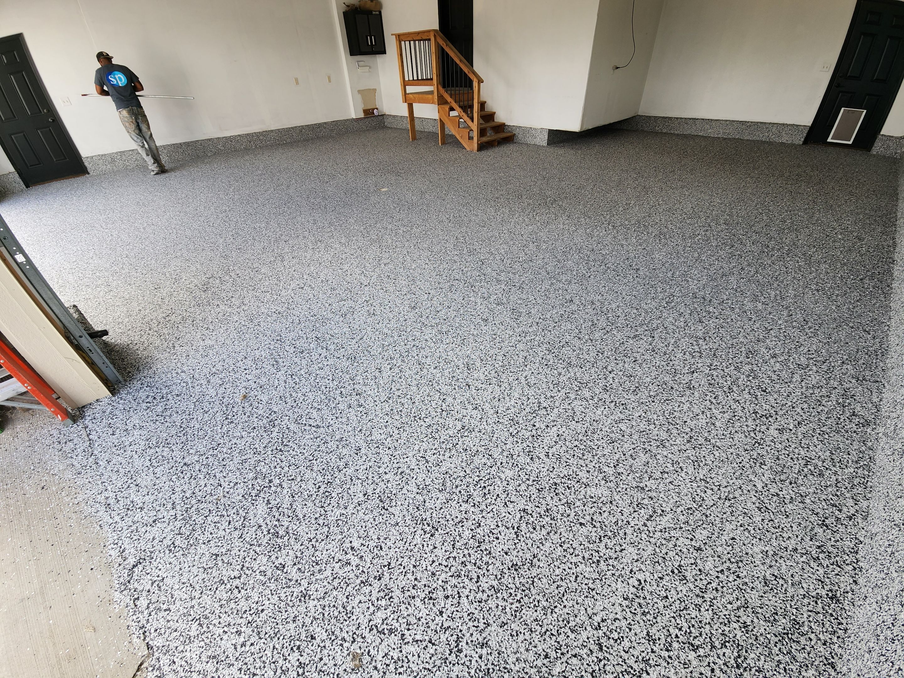 Domino Flake Garage Floor Epoxy Coating in Brandon by Select Painting, Coatings & Garage Cabinets