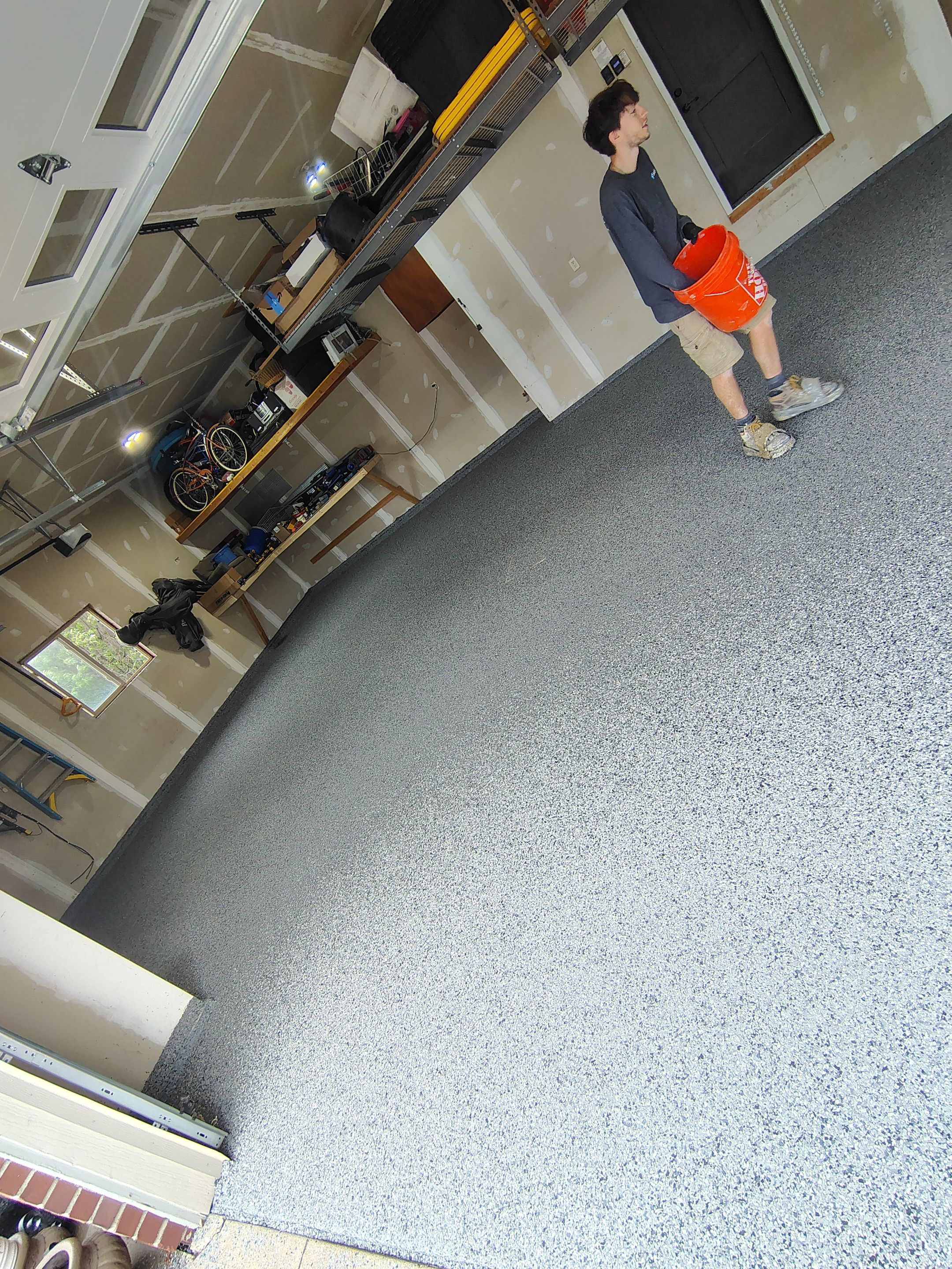 Sioux Falls Garage Concrete Grinding and Nightfall Decorative Chip Coating by Select Painting, Coatings & Garage Cabinets
