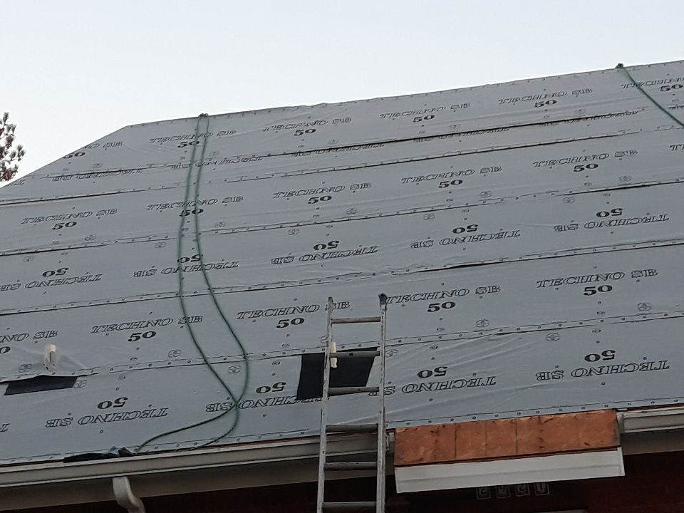 Residential Roofing Installation using Roof Replacement by American Roofing & Construction LLC