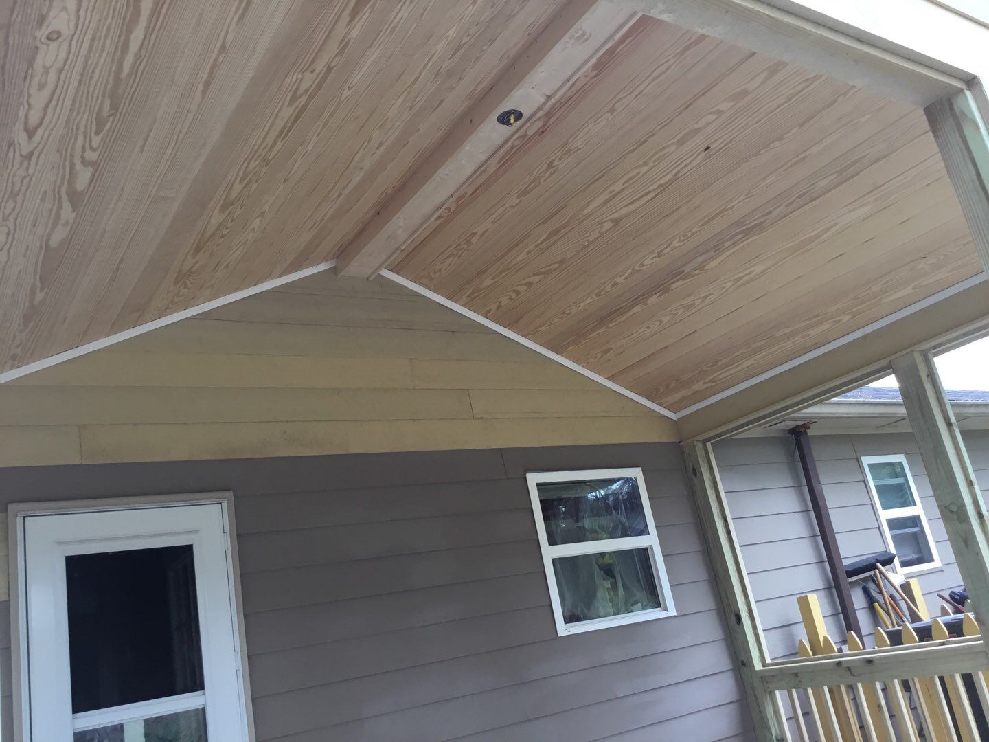 Screened Porch Construction with Vaulted Wood Ceiling in Douglasville by Swift Home Renovations