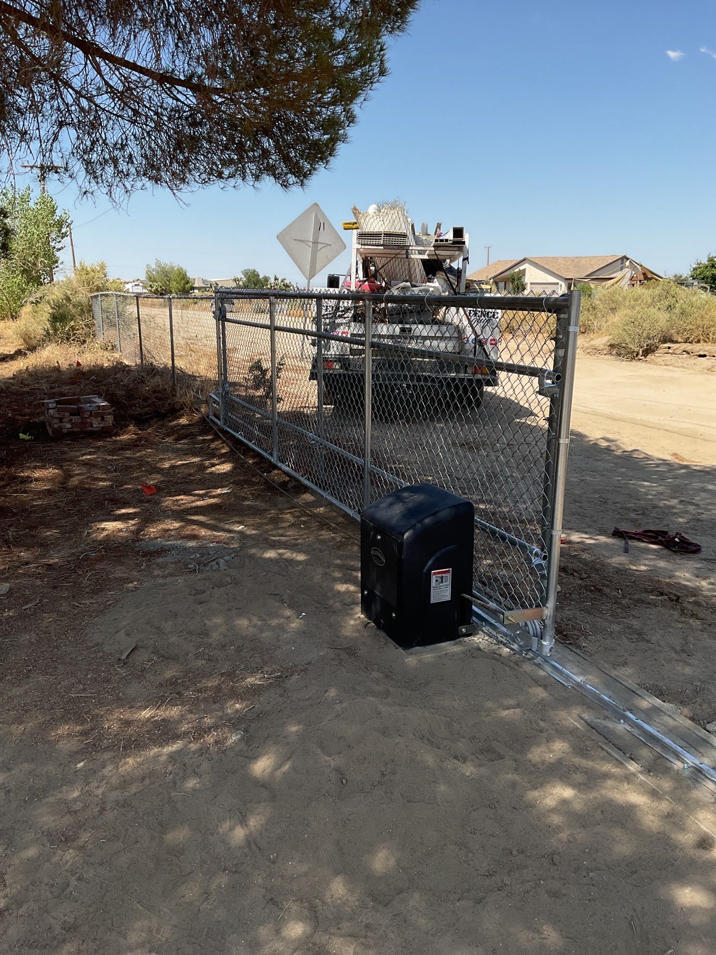 4ft White Vinyl & Chain link Slider Gate with Solar Motor by Fence Guys Inc.