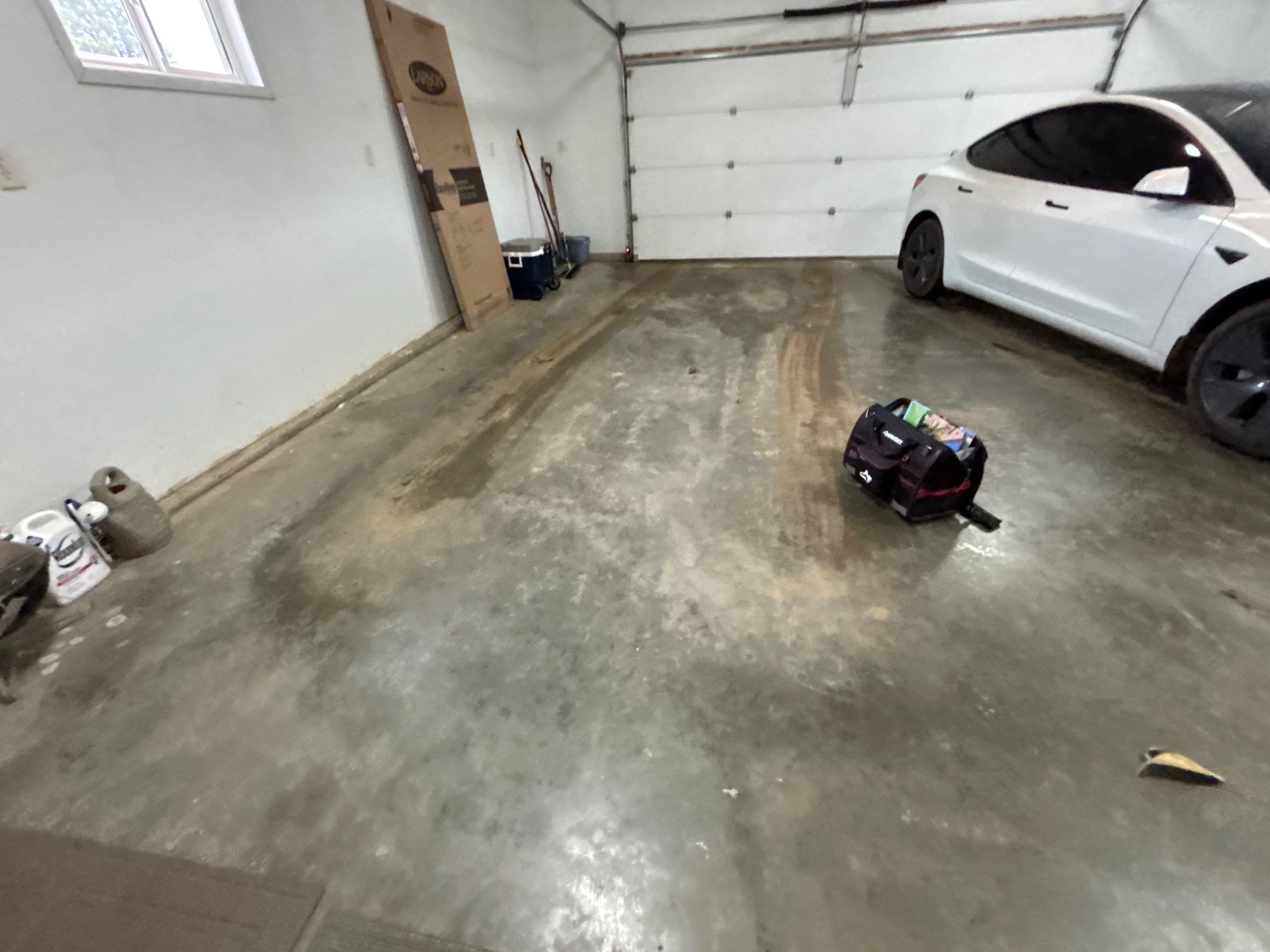 Full Garage Floor and Basement Stair Epoxy Coating in Sioux Falls by Select Painting, Coatings & Garage Cabinets