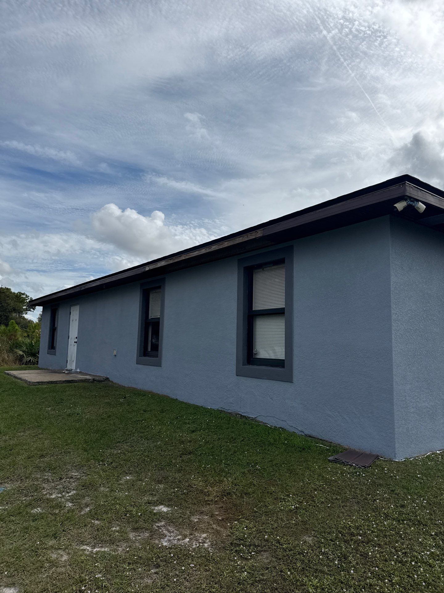 Black Seamless Gutters & Soffit/Fascia in Lehigh Acres FL by Gutter Professors
