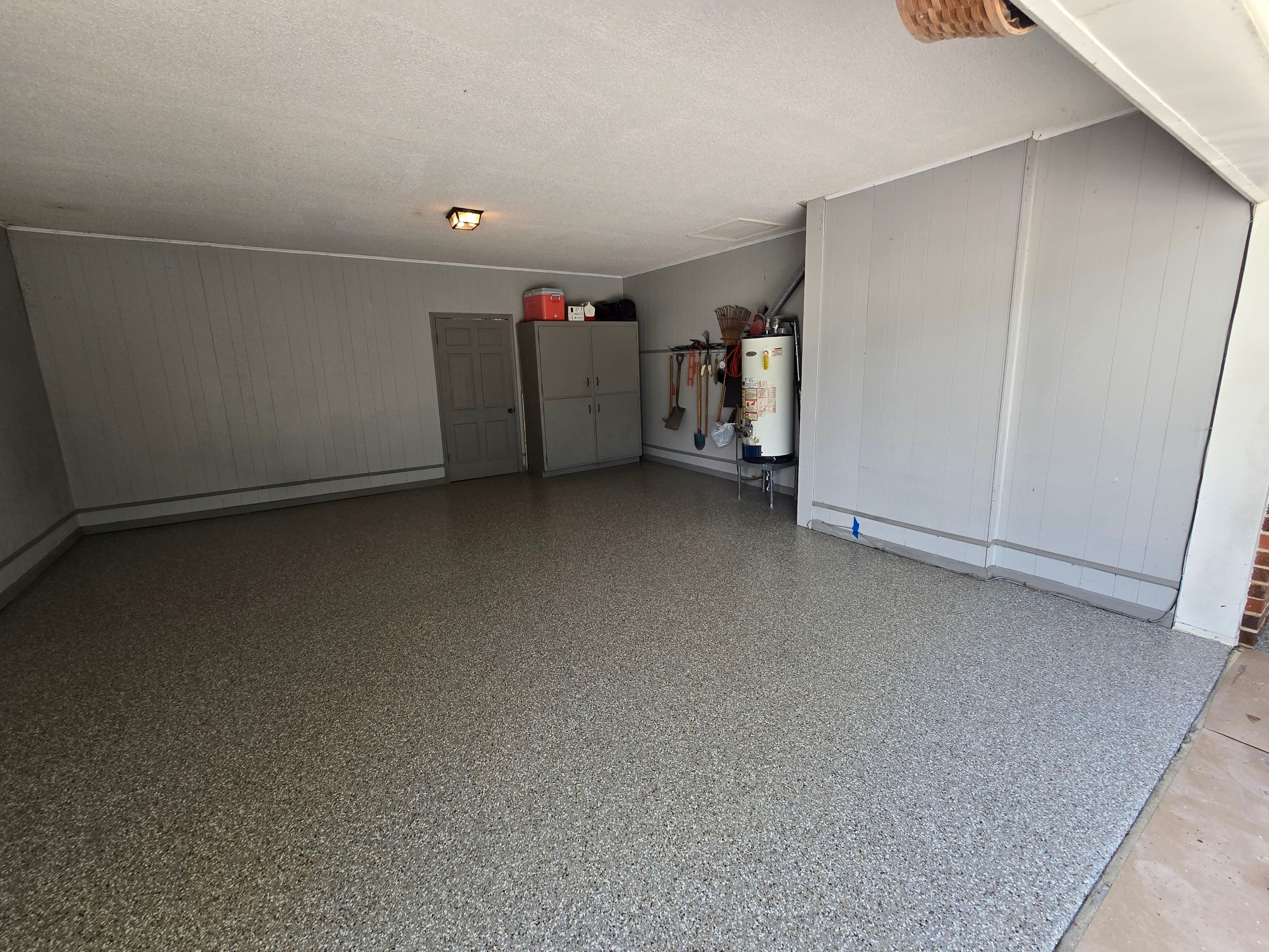 Front Porch & Garage Using Creekbed by Elite Floor Solutions