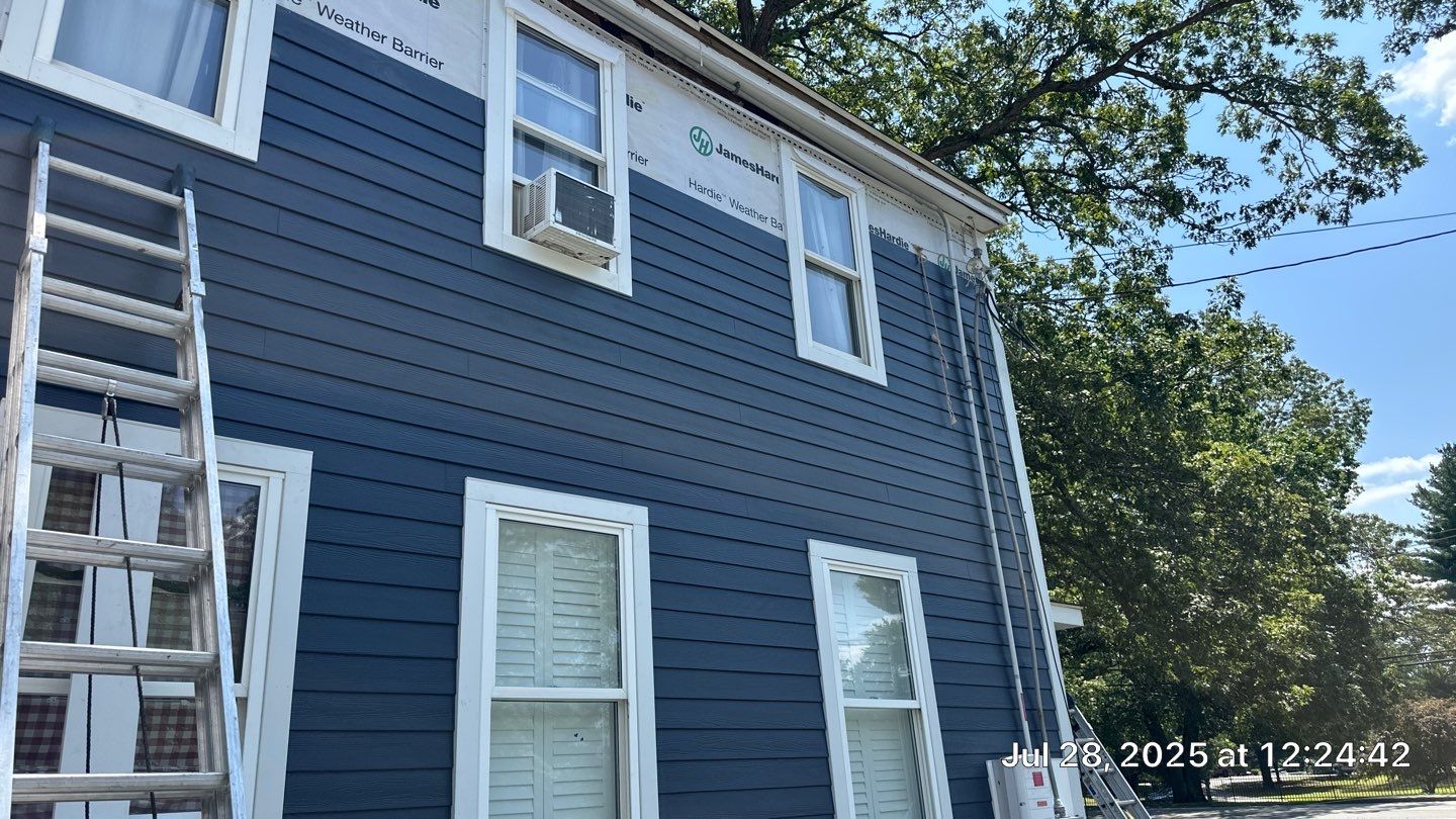 James Hardie Lap Siding Installation in Chelmsford, MA by Mighty Dog Roofing of Greater Middlesex County