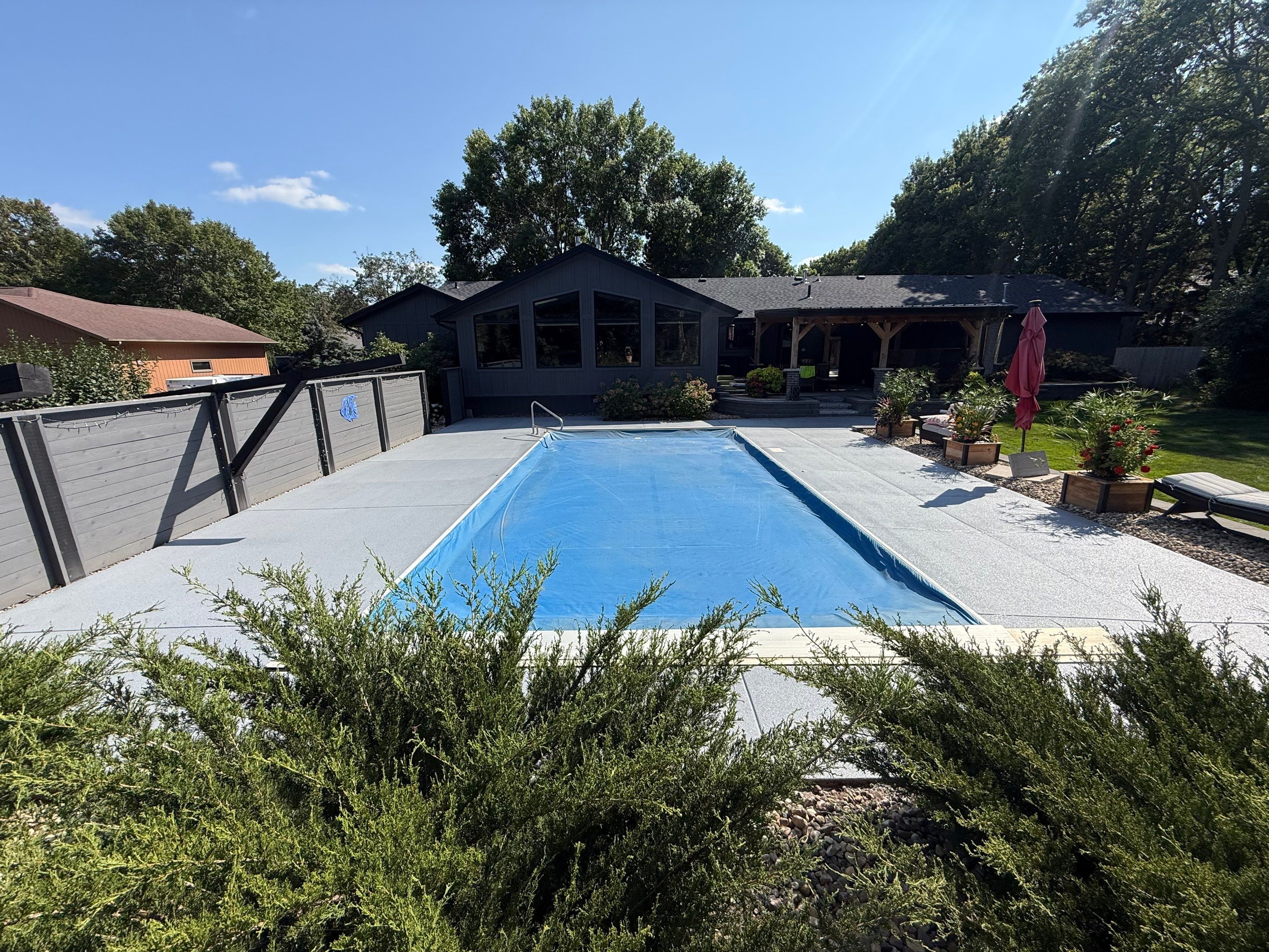 Garage Floor and Textured Pool Deck Coating in Sioux Falls by Select Painting, Coatings & Garage Cabinets