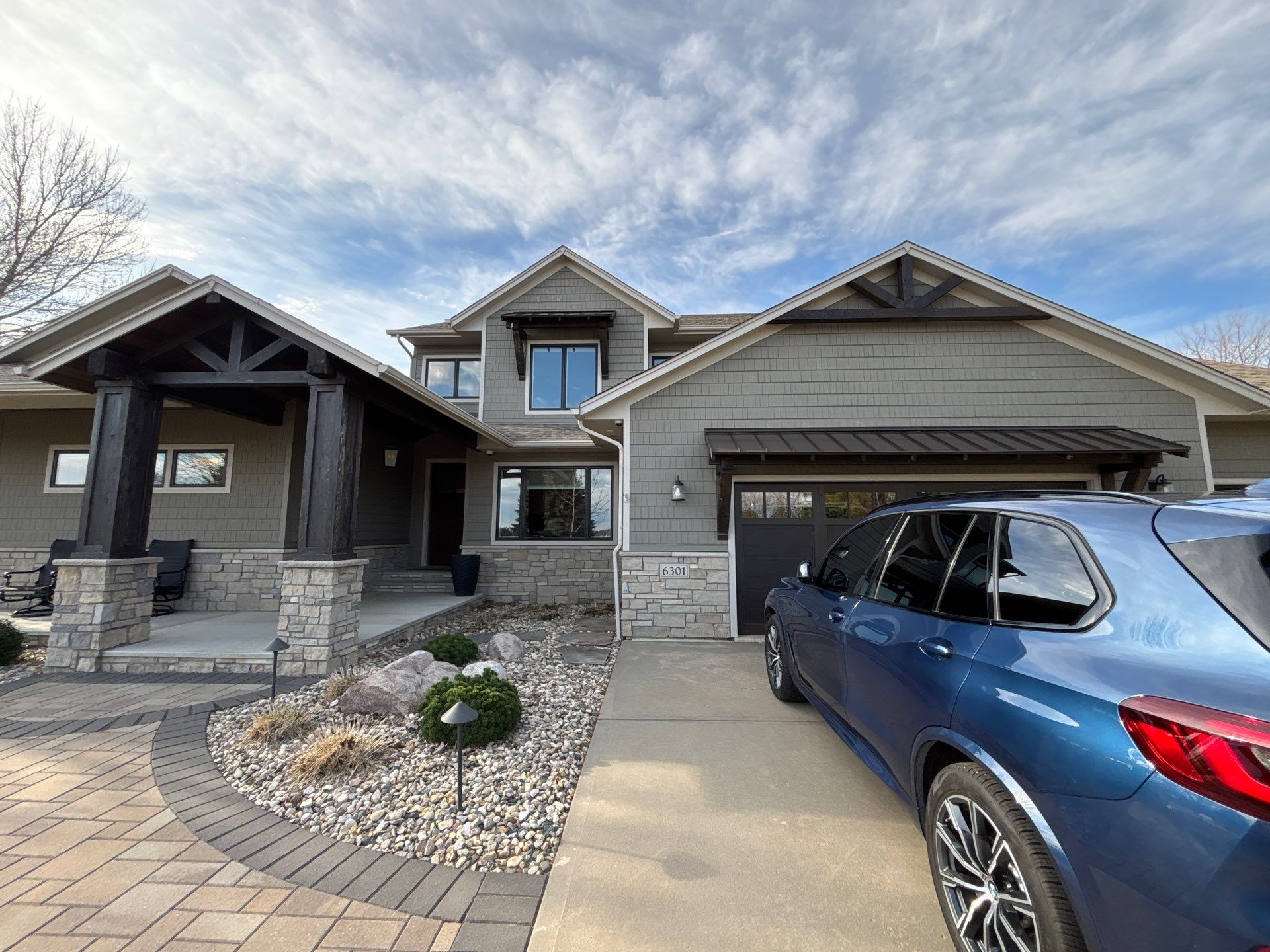 Exterior Wood Staining and Epoxy Garage Floor Coating in Brandon by Select Painting, Coatings & Garage Cabinets
