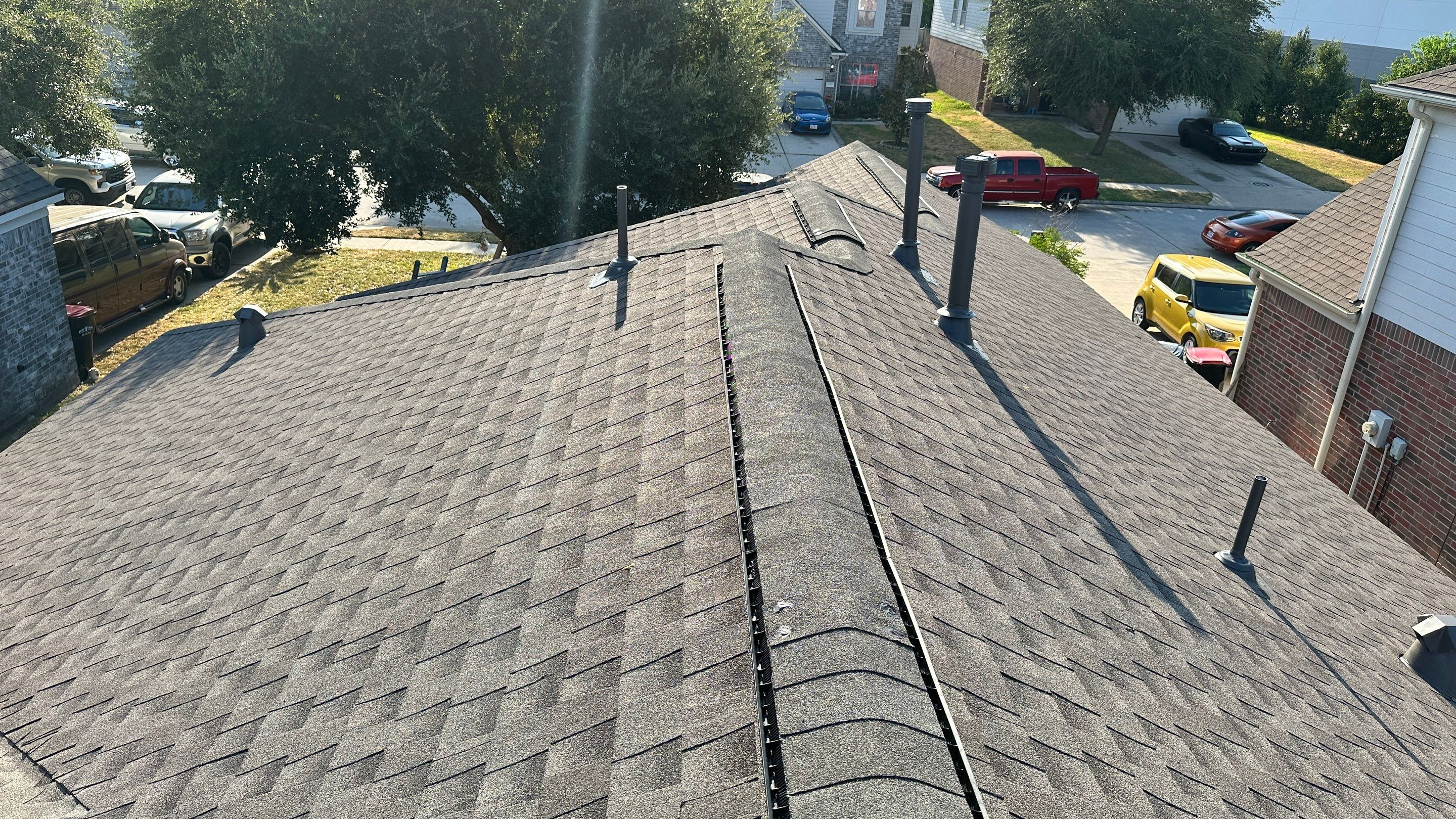 Full Roof Replacement on Two-Story Brick Home — Spring, TX by PL Roofing & SB Roofing, LLC.